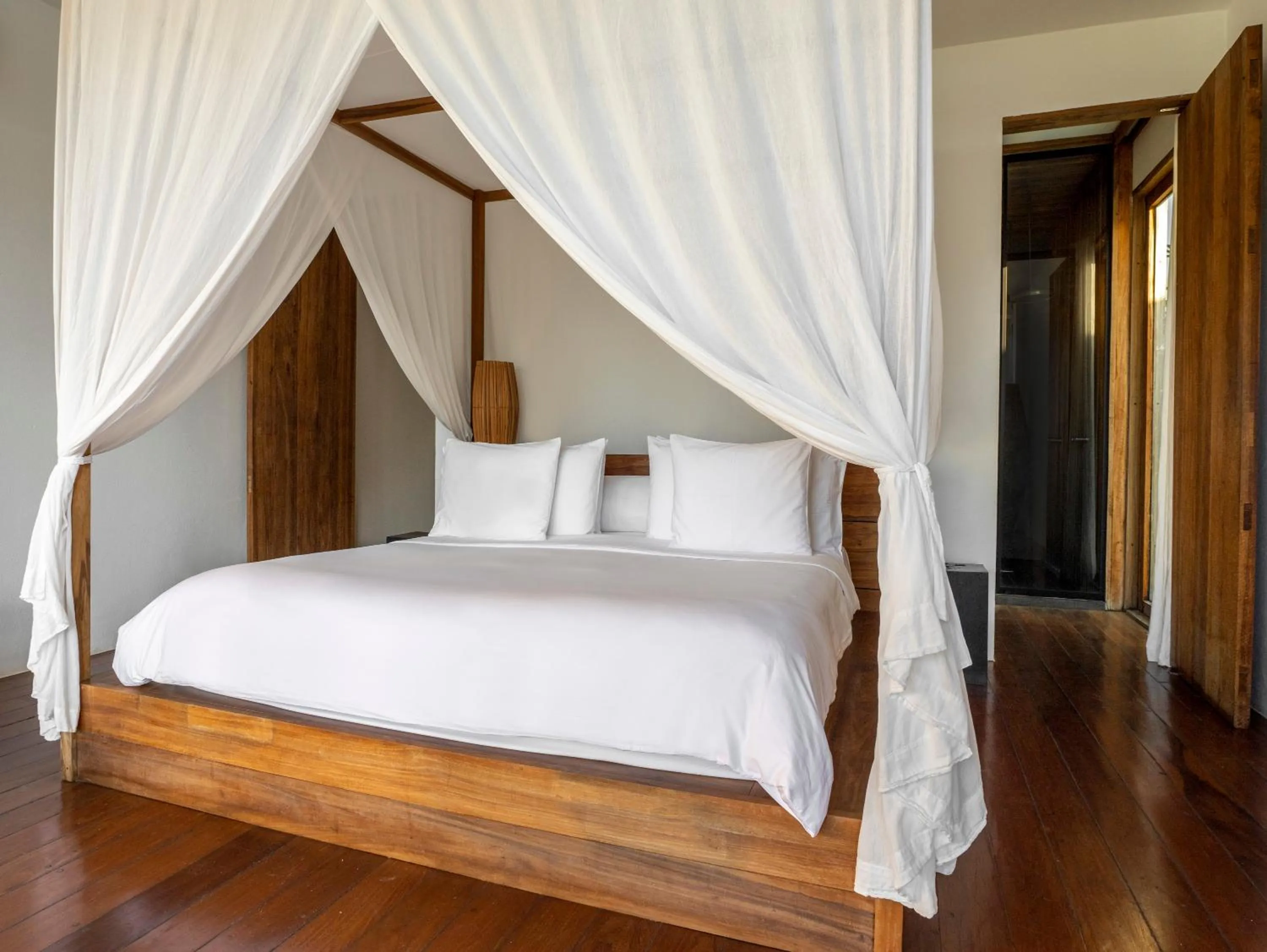 Bed in KA BRU Beach Boutique Hotel