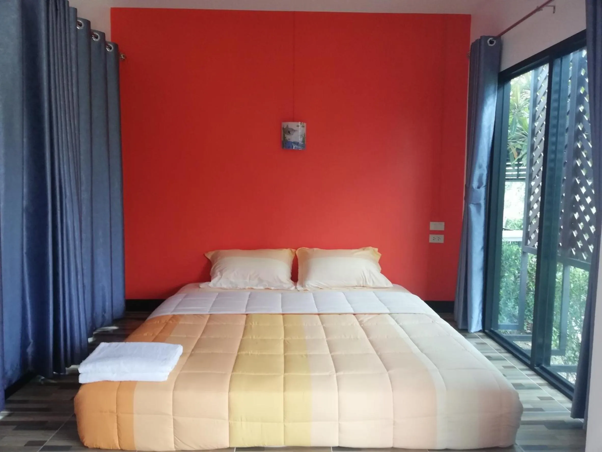 Bed in T'Luck House Resort