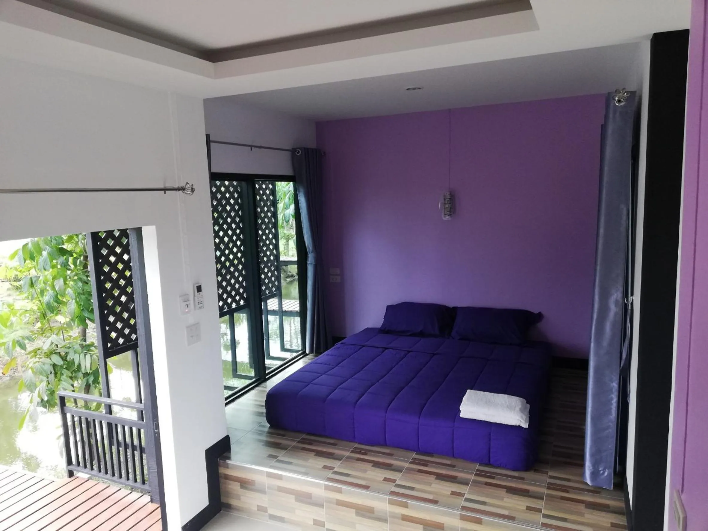 Bed in T'Luck House Resort