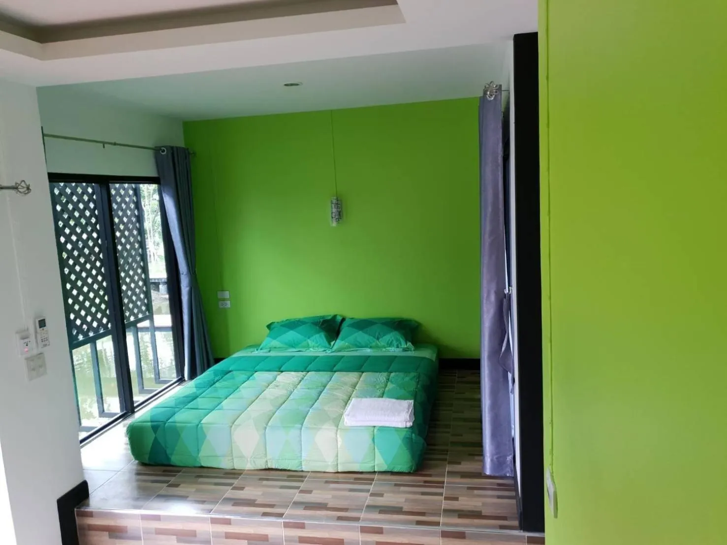 Bed in T'Luck House Resort