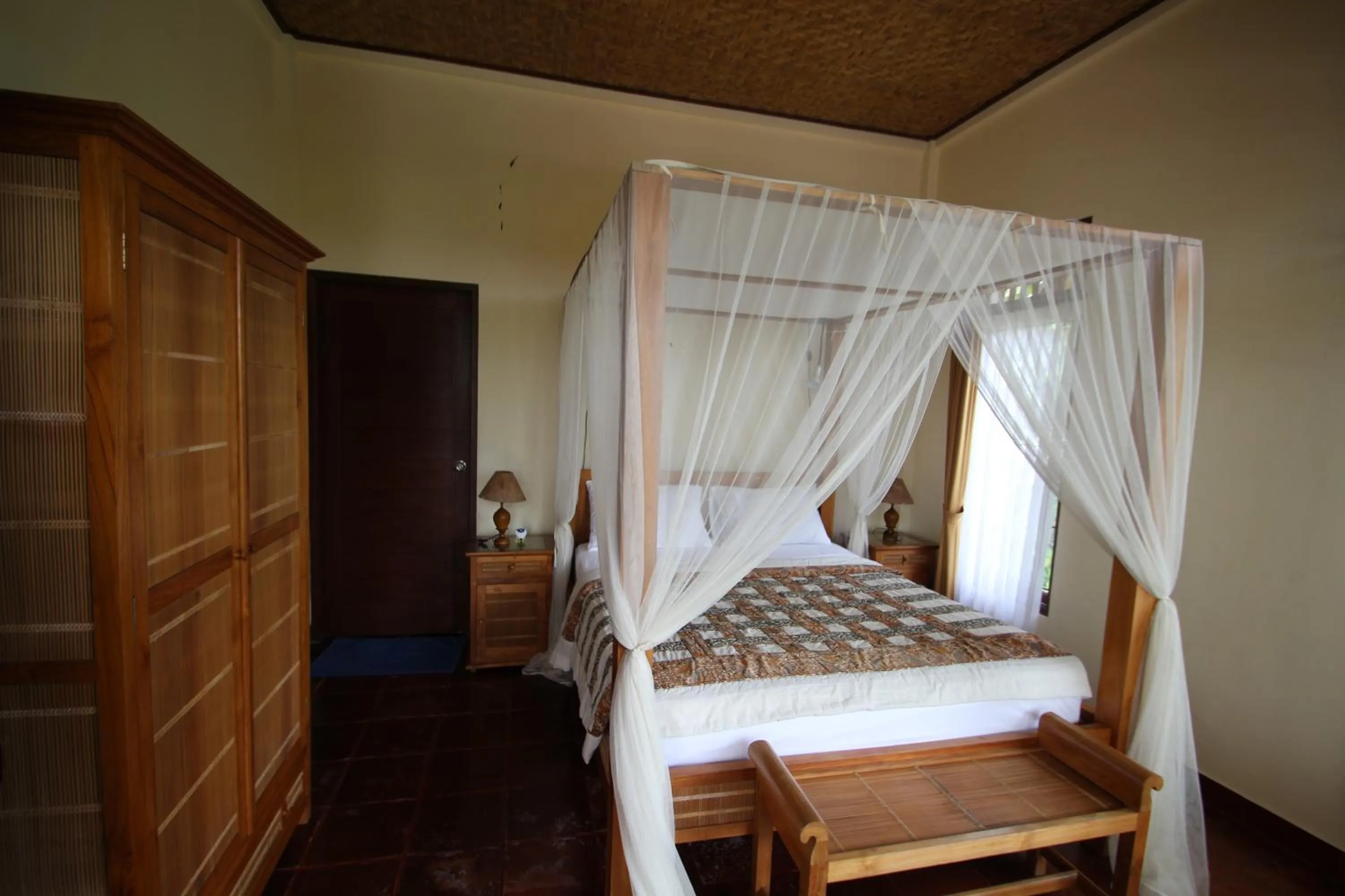Bed in Uma Capung Mas Cottage