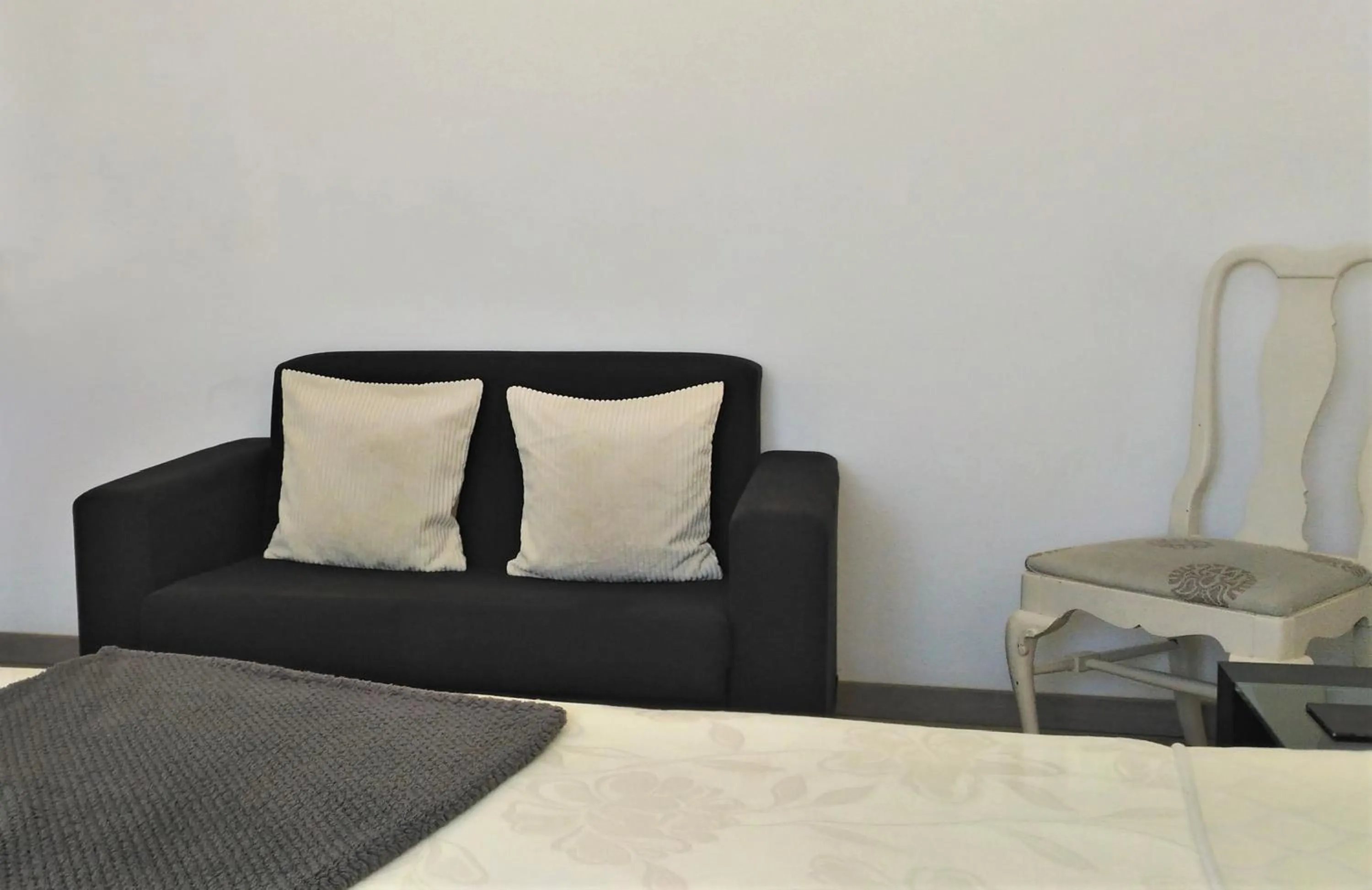 Seating area, Bed in Suites Inn Lagos