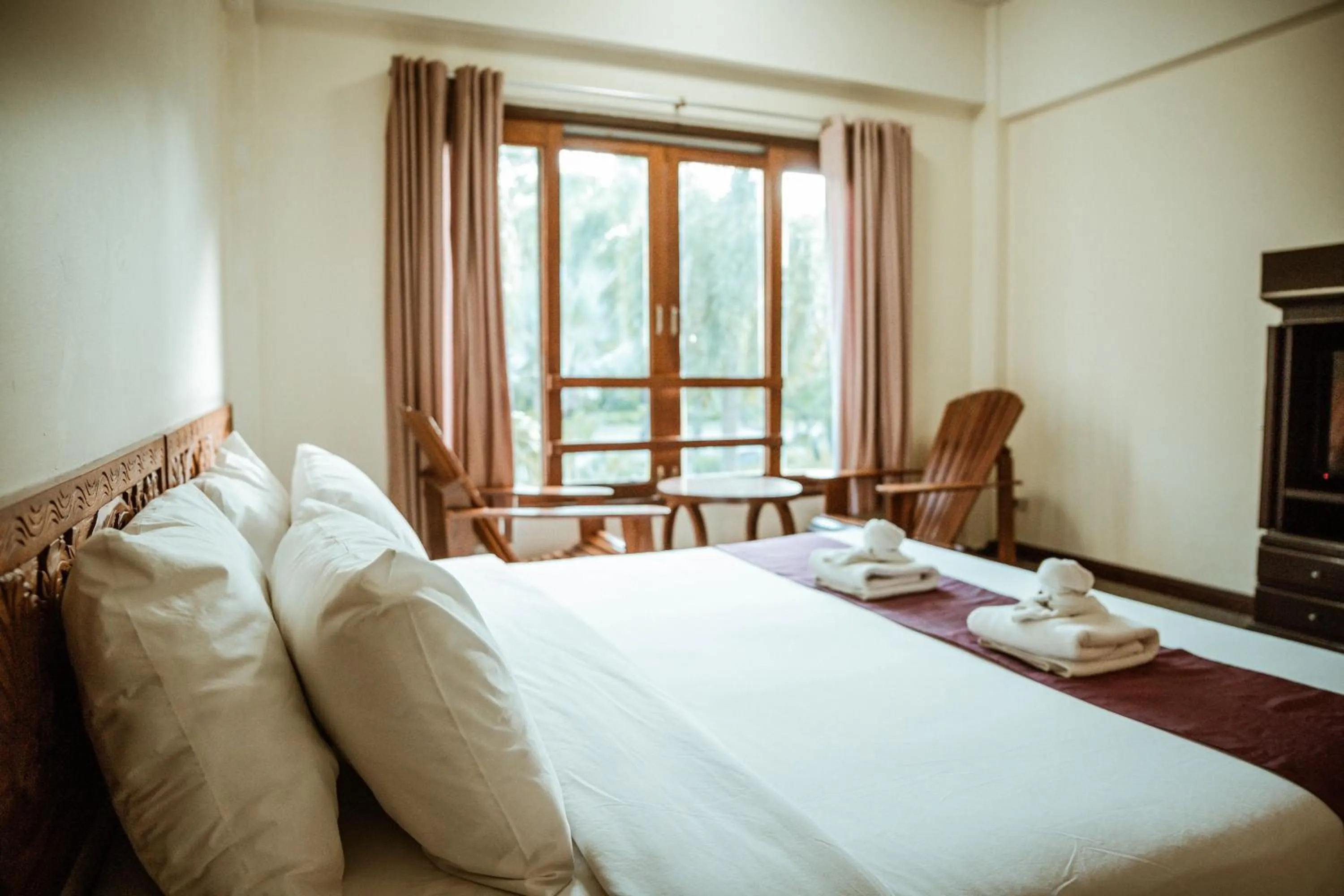 Bed in Tak Andaman Resort & Hotel