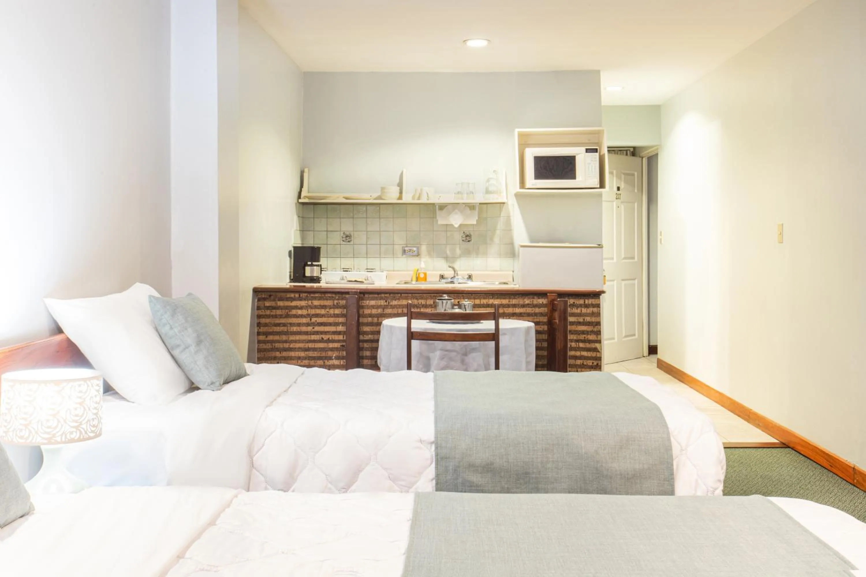 Kitchen or kitchenette, Bed in Apartotel Tairona