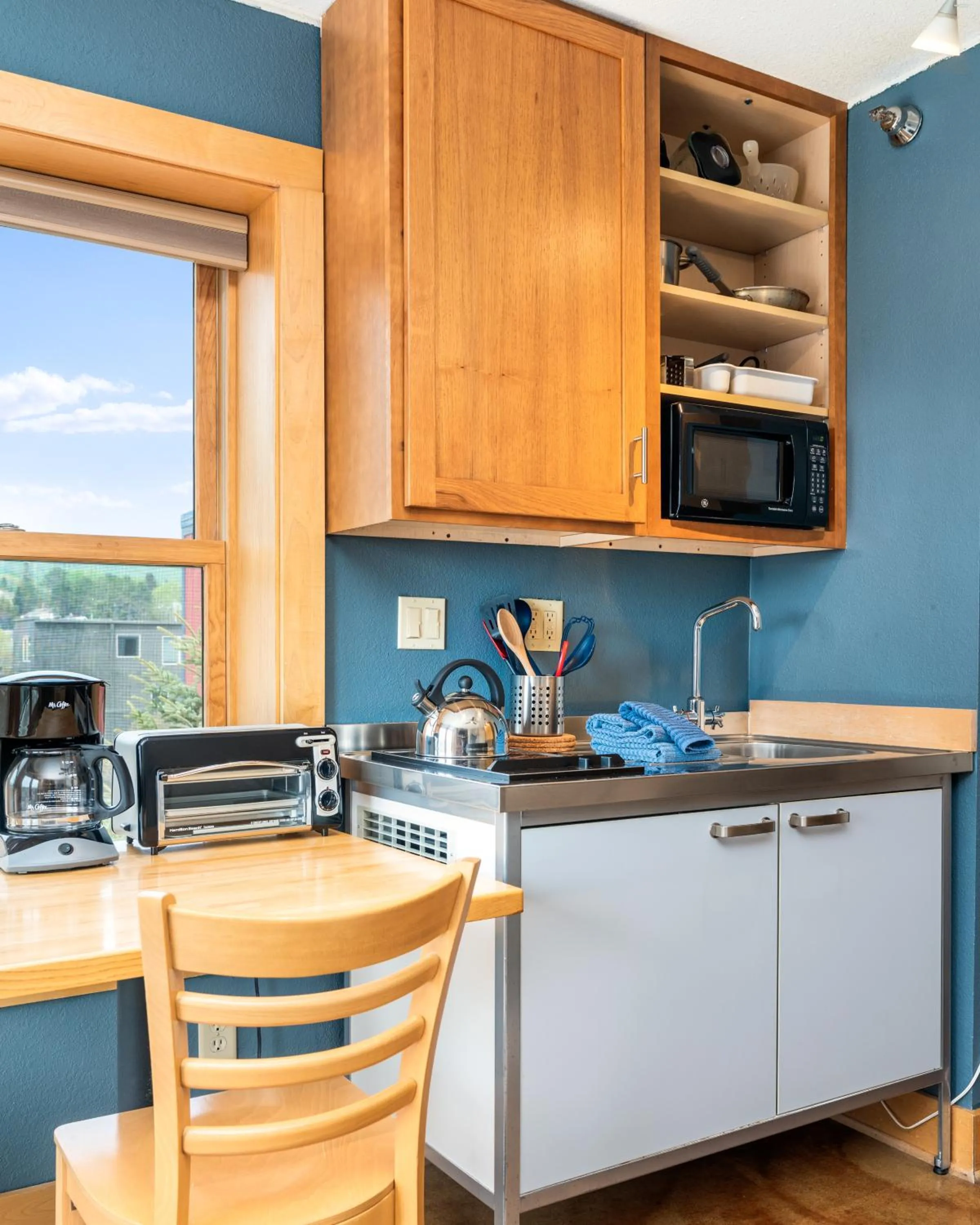 Kitchen or kitchenette in East Bay Suites