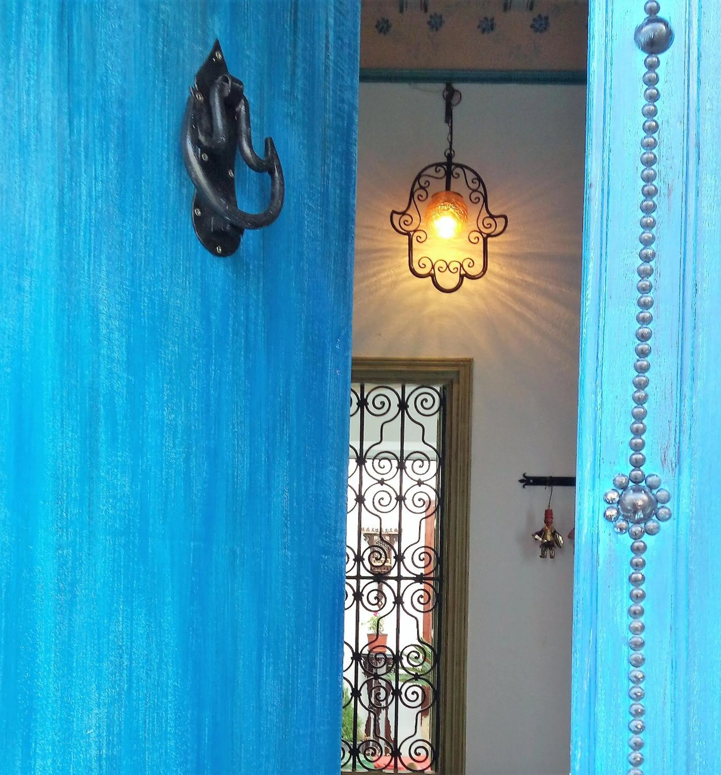 Facade/entrance in El Patio Courtyard House