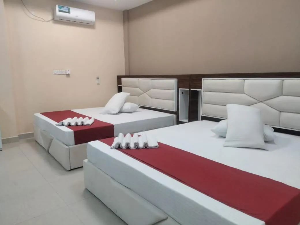 Bed in Gnaanams Hotel and Restaurant