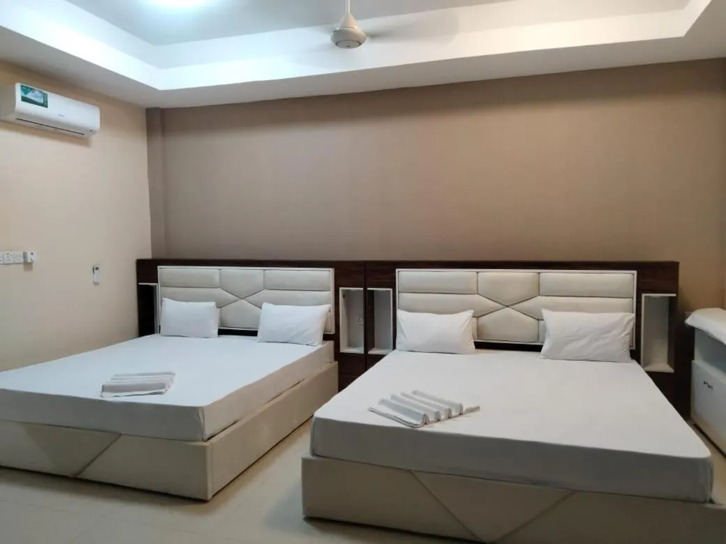 Bed in Gnaanams Hotel and Restaurant