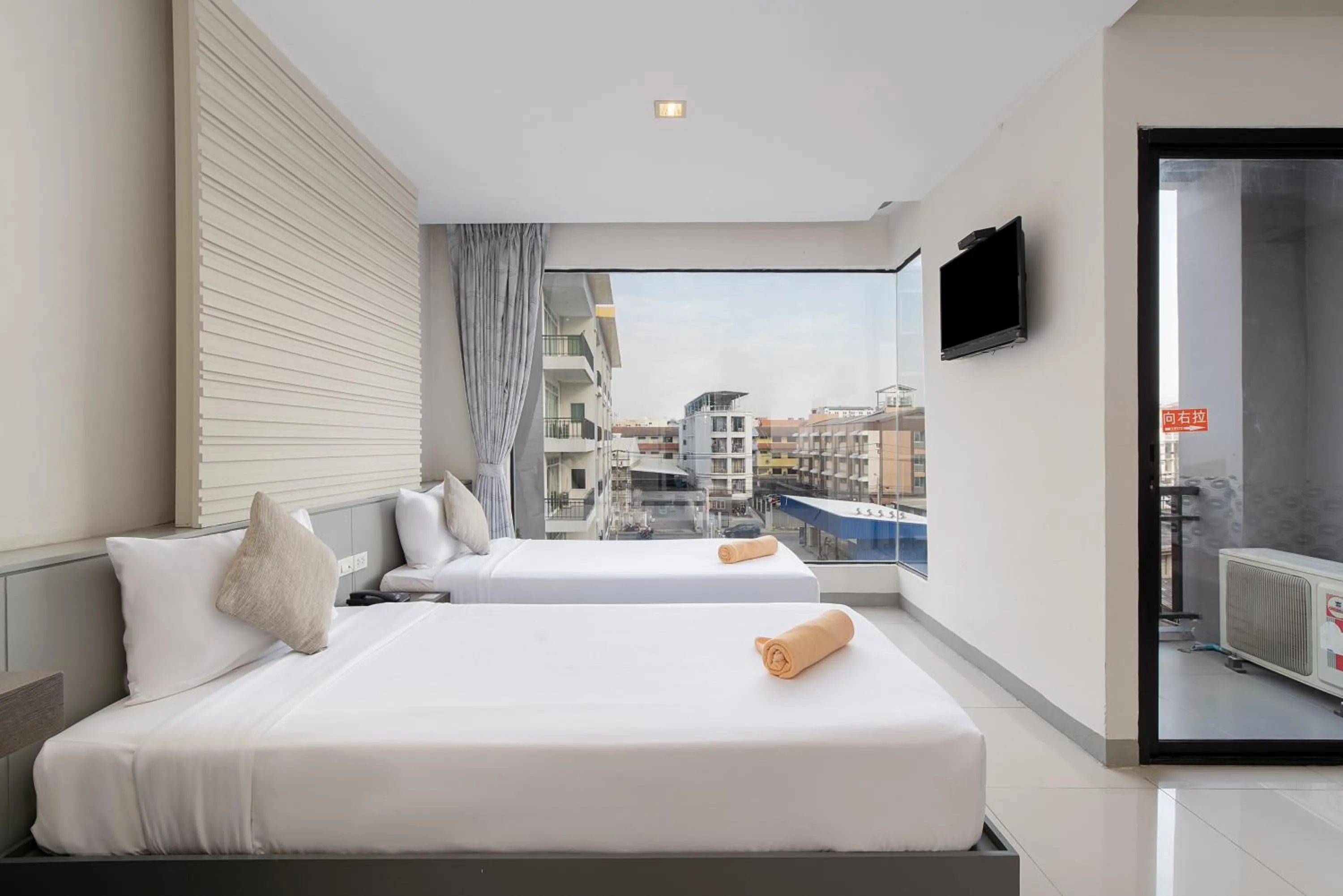 Bed in Leenova Hotel