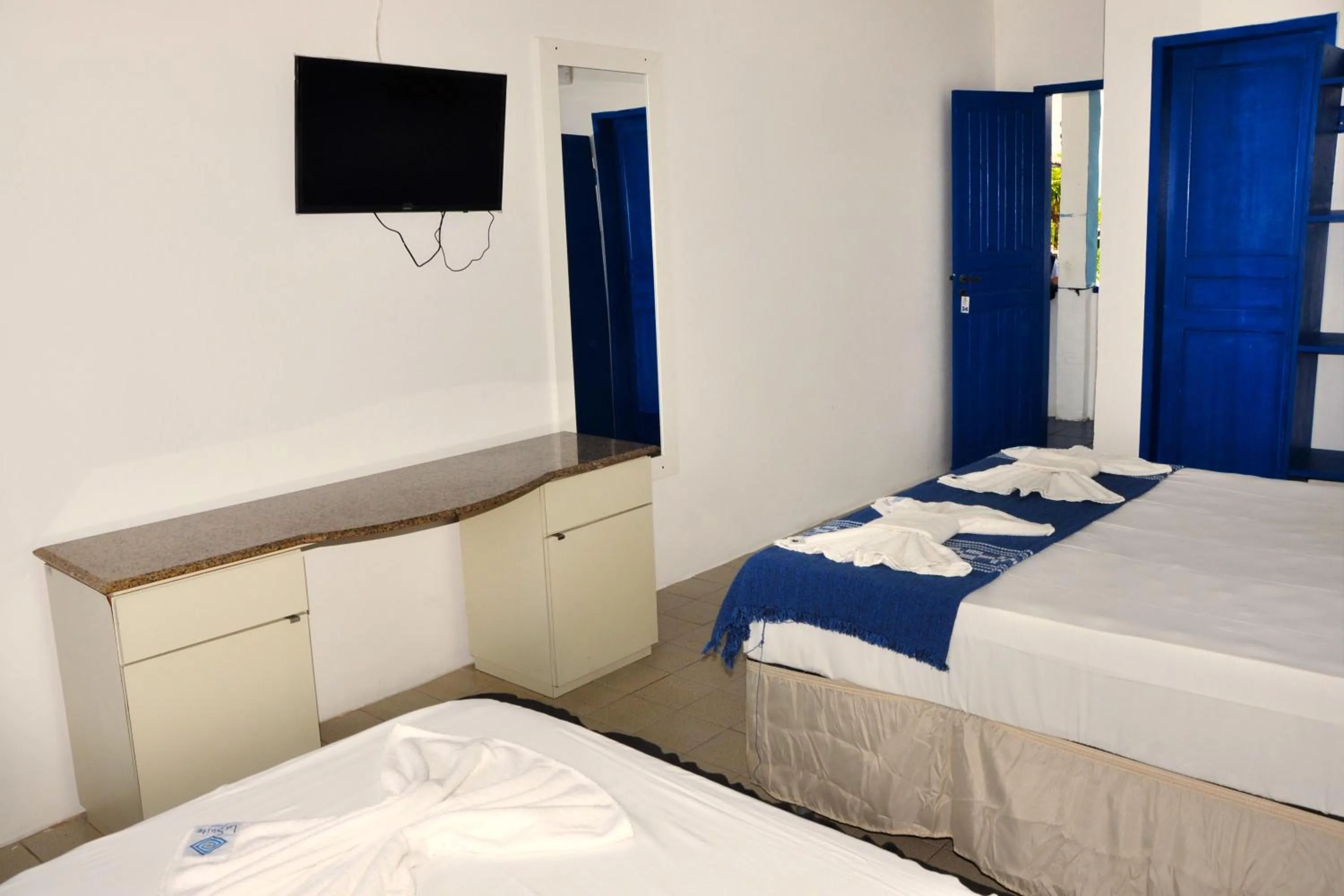 Bed in La Suite Praia Hotel