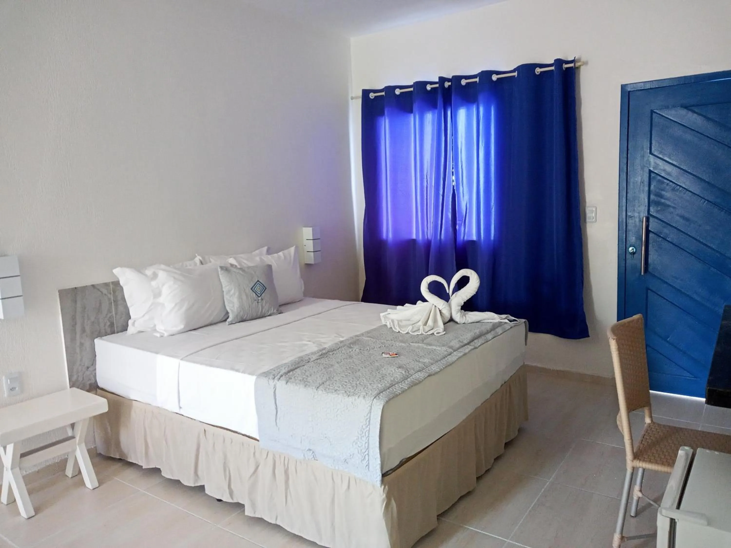 Bed in La Suite Praia Hotel