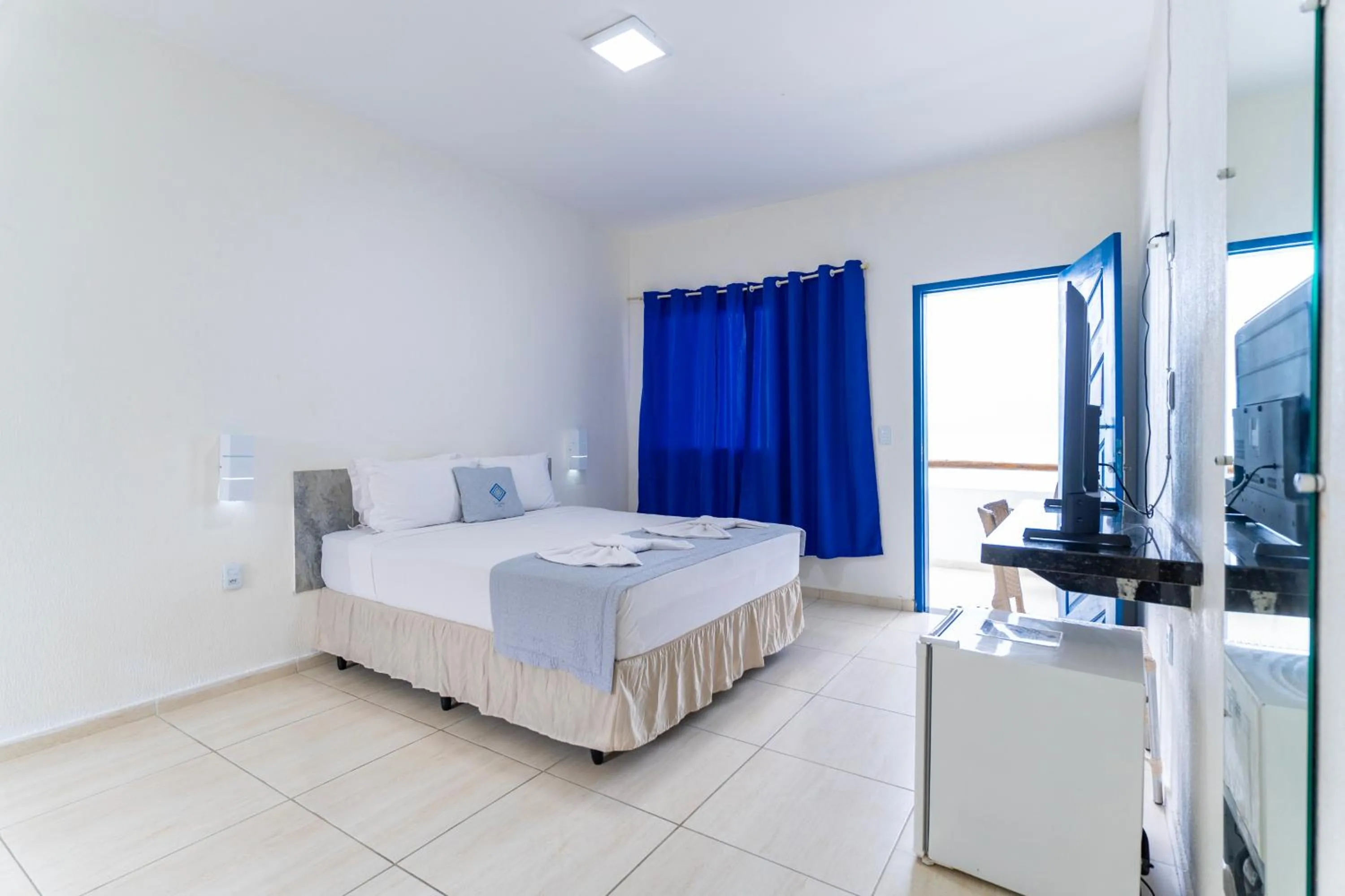 Bed in La Suite Praia Hotel