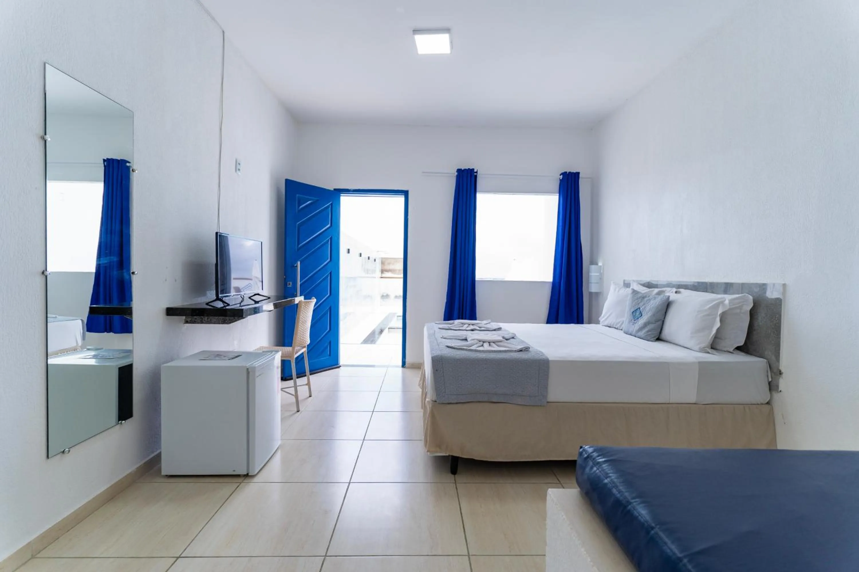 Bed in La Suite Praia Hotel