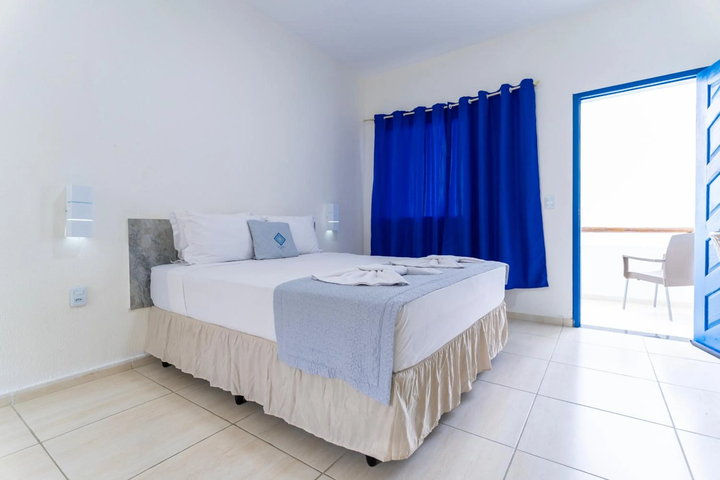 Bed in La Suite Praia Hotel