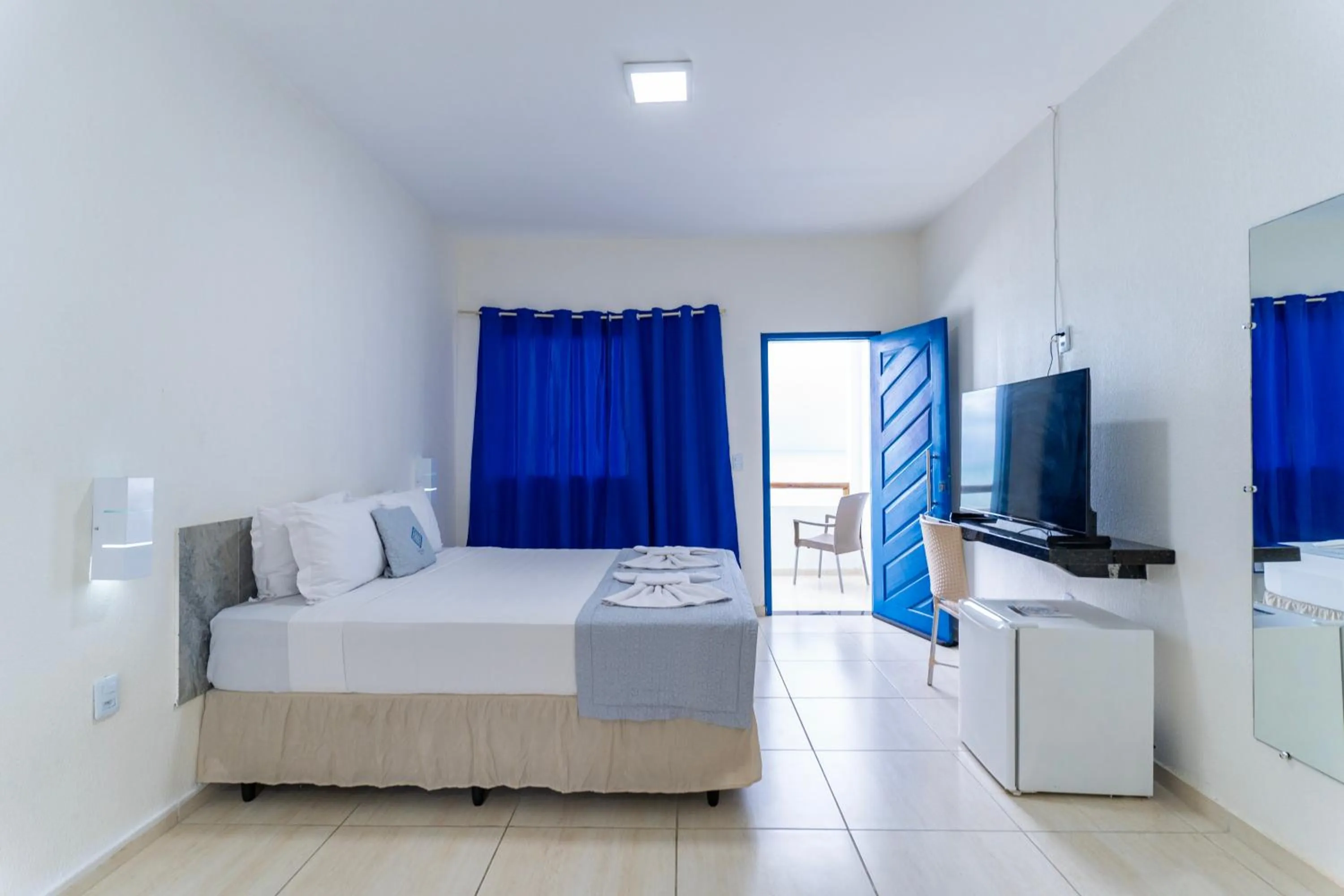 Bed in La Suite Praia Hotel