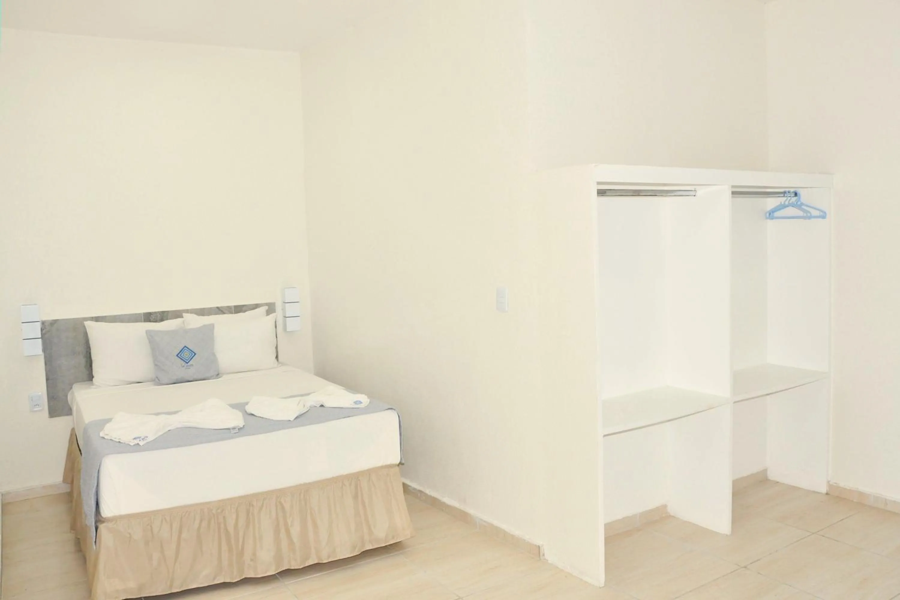 Photo of the whole room, Bed in La Suite Praia Hotel