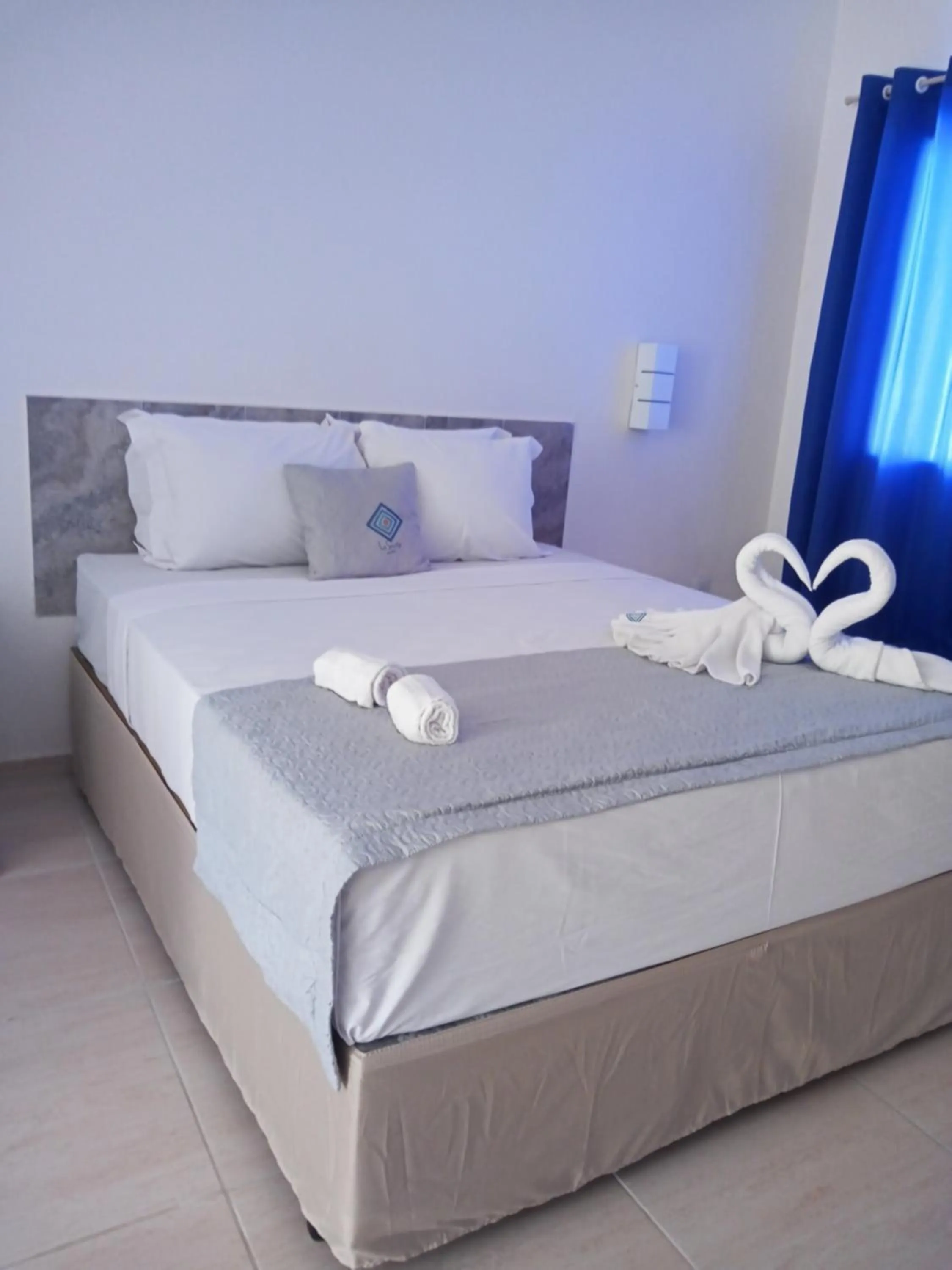 Bed in La Suite Praia Hotel