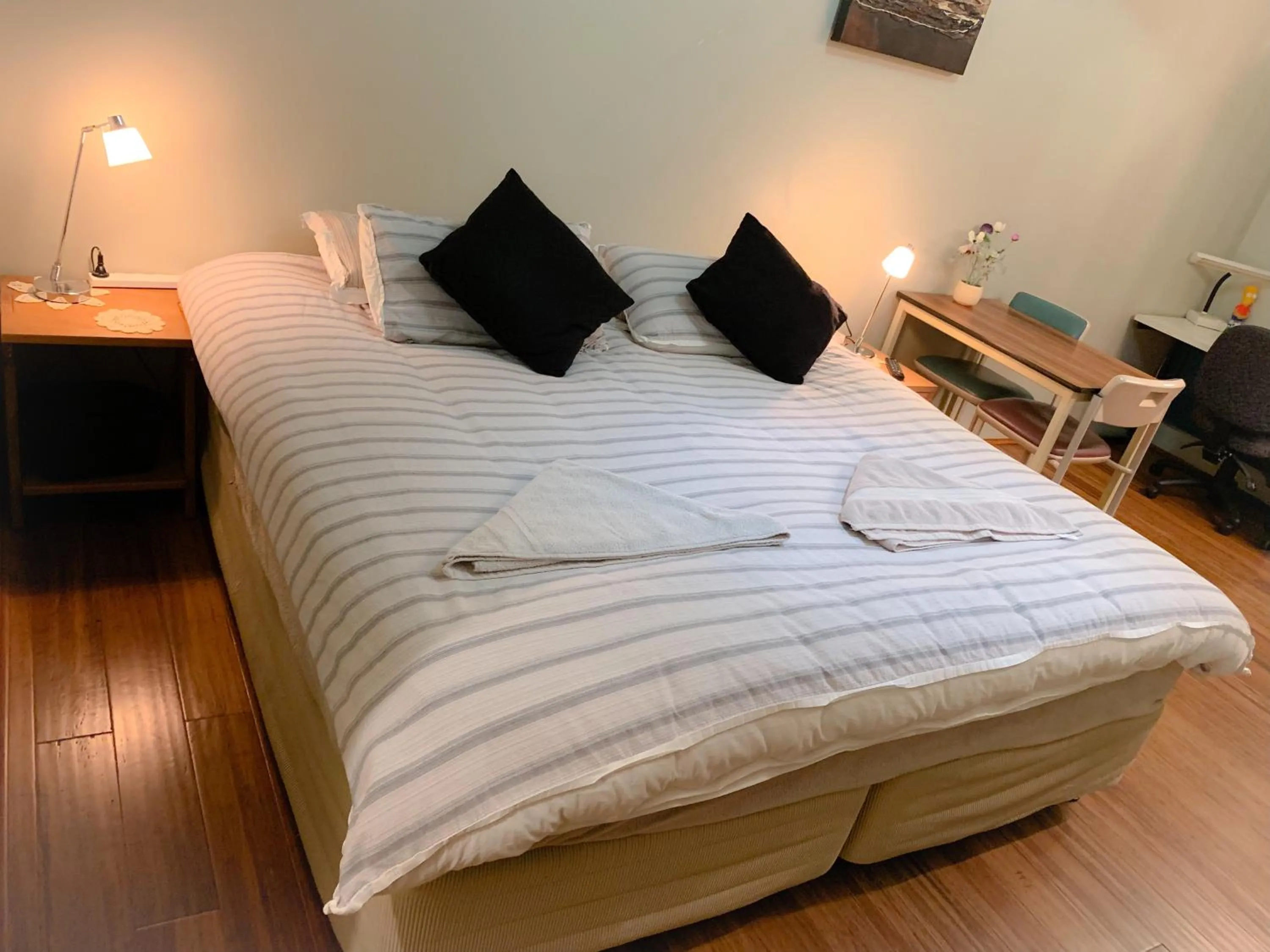 Bed in Westside Studio Apartments