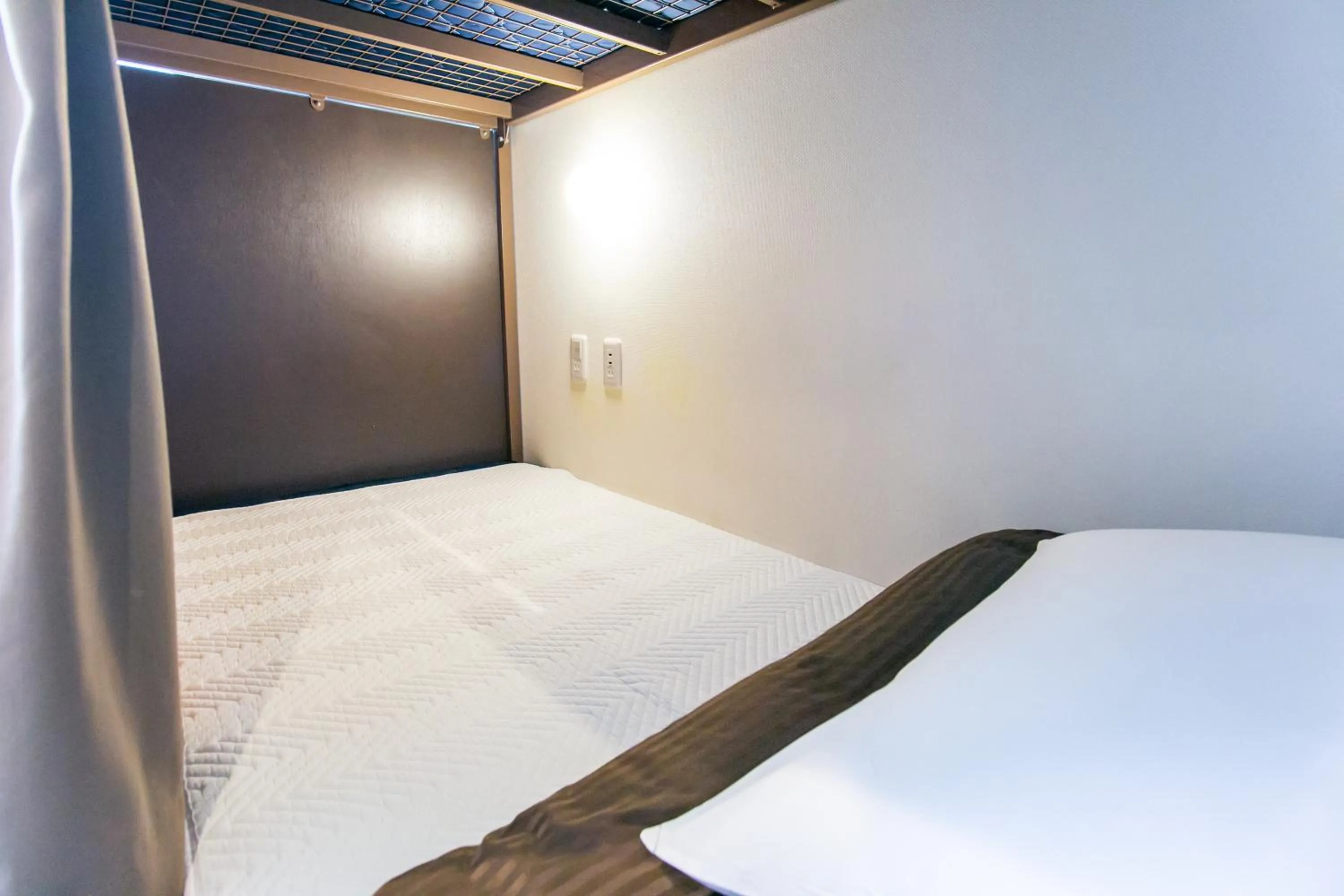 Bed in Oak Hotel Edo