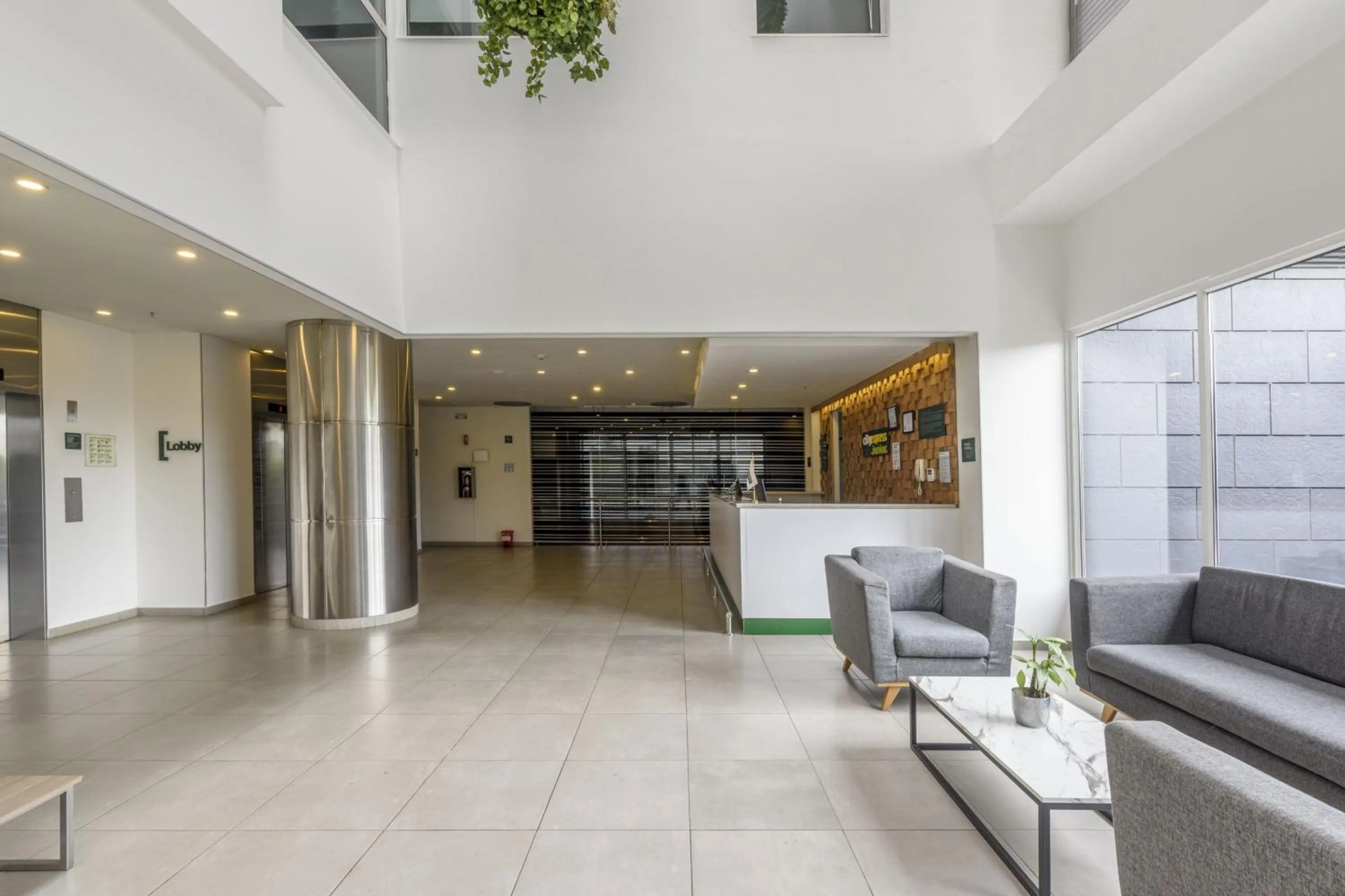 Living room in City Express Junior by Marriott Bogota Aeropuerto