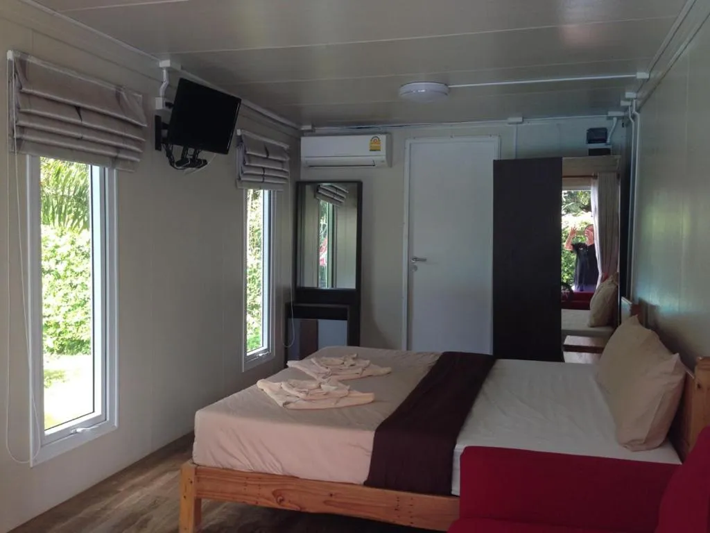 Photo of the whole room, Bed in Check In and Chill Out