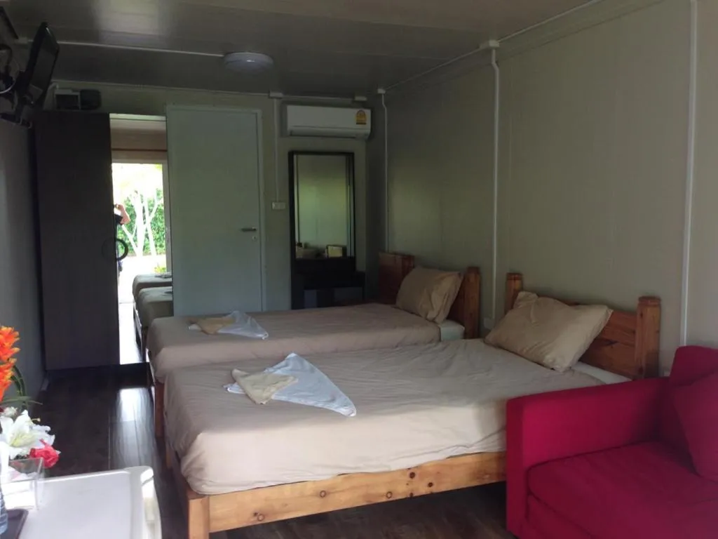 Photo of the whole room, Bed in Check In and Chill Out