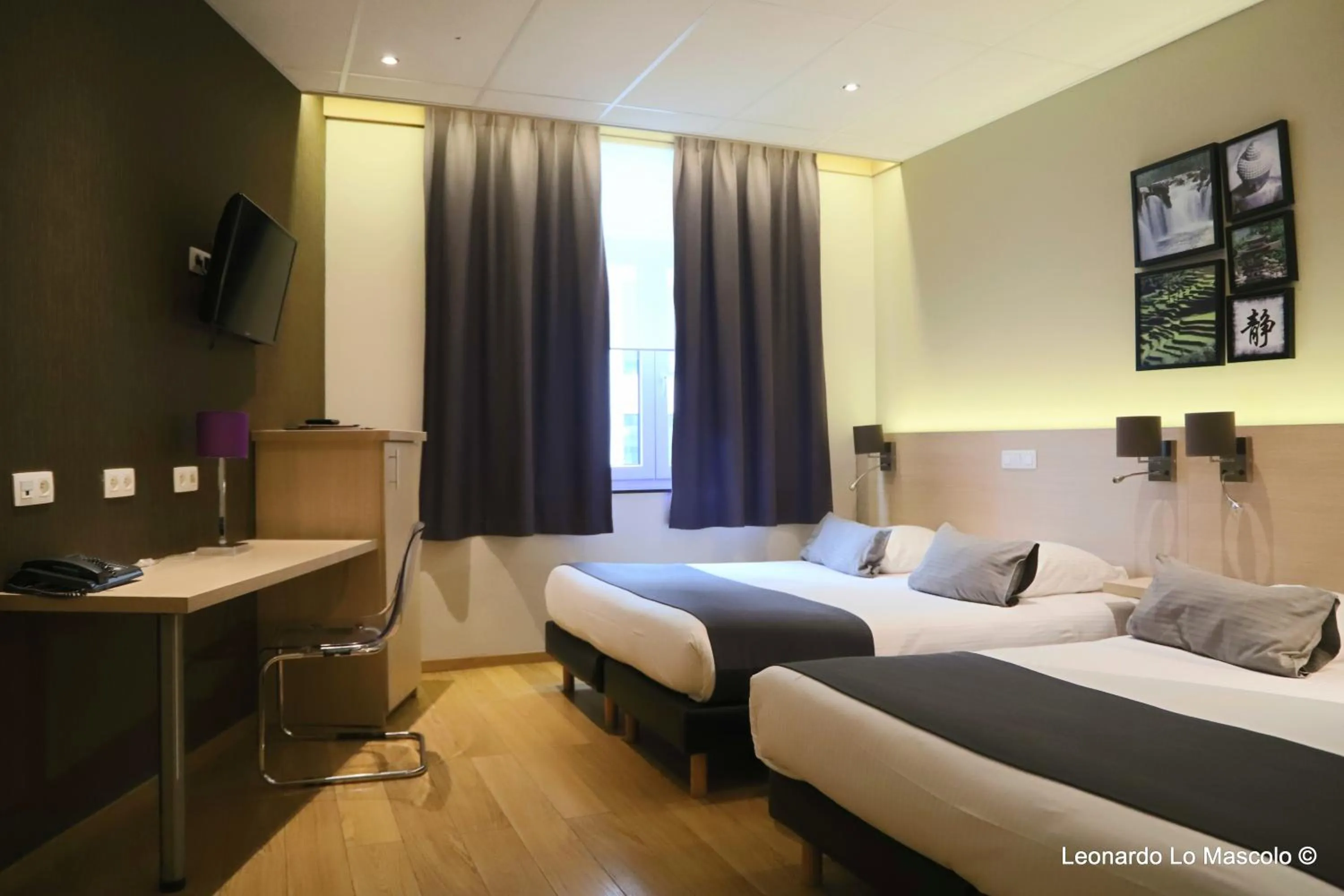 Bed in Hôtel de l'Univers Liège