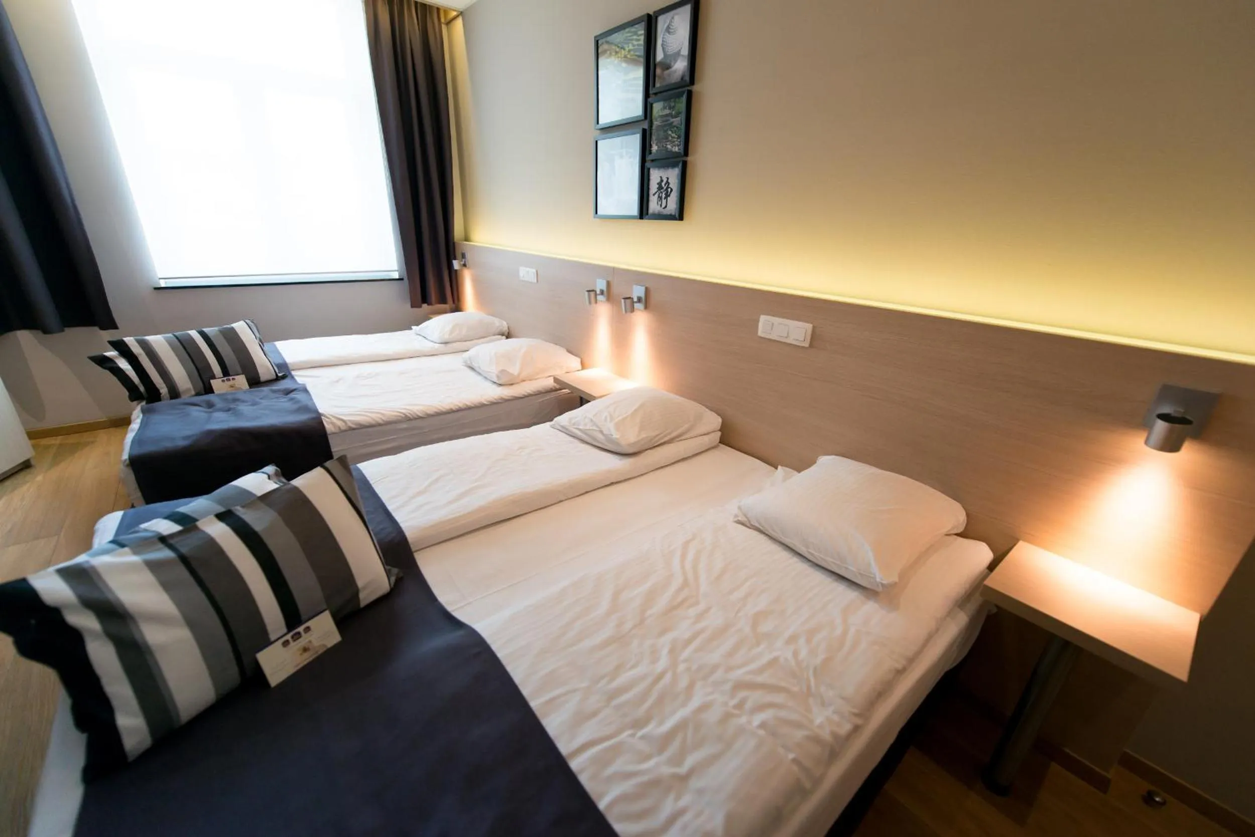 Bed in Hôtel de l'Univers Liège