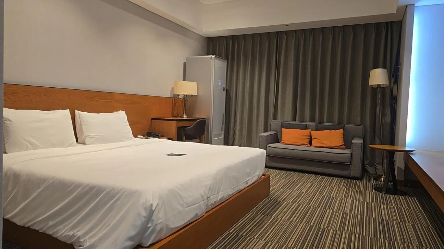 Bed in Golden Tulip Incheon Airport Hotel