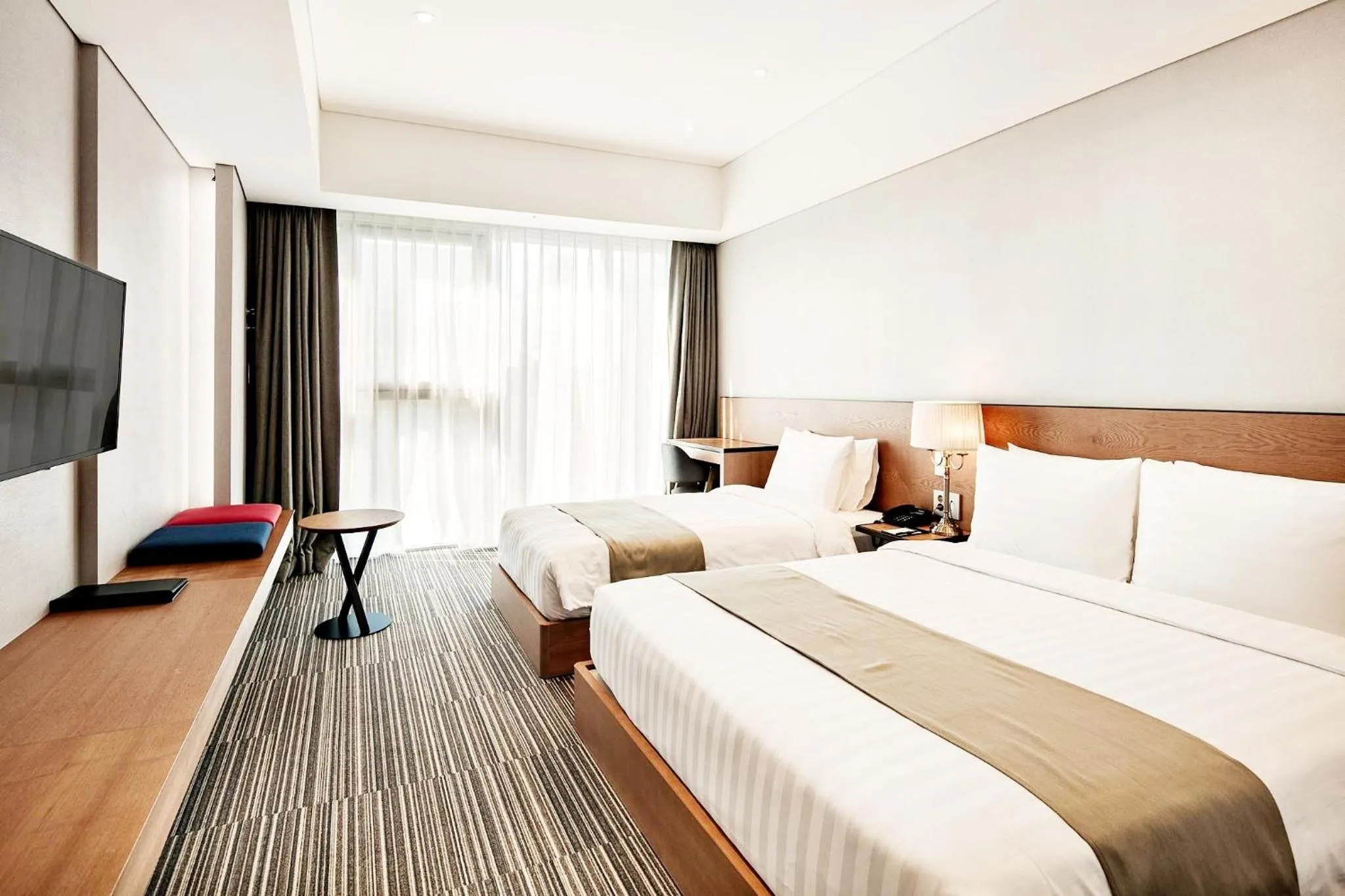 Bed in Golden Tulip Incheon Airport Hotel