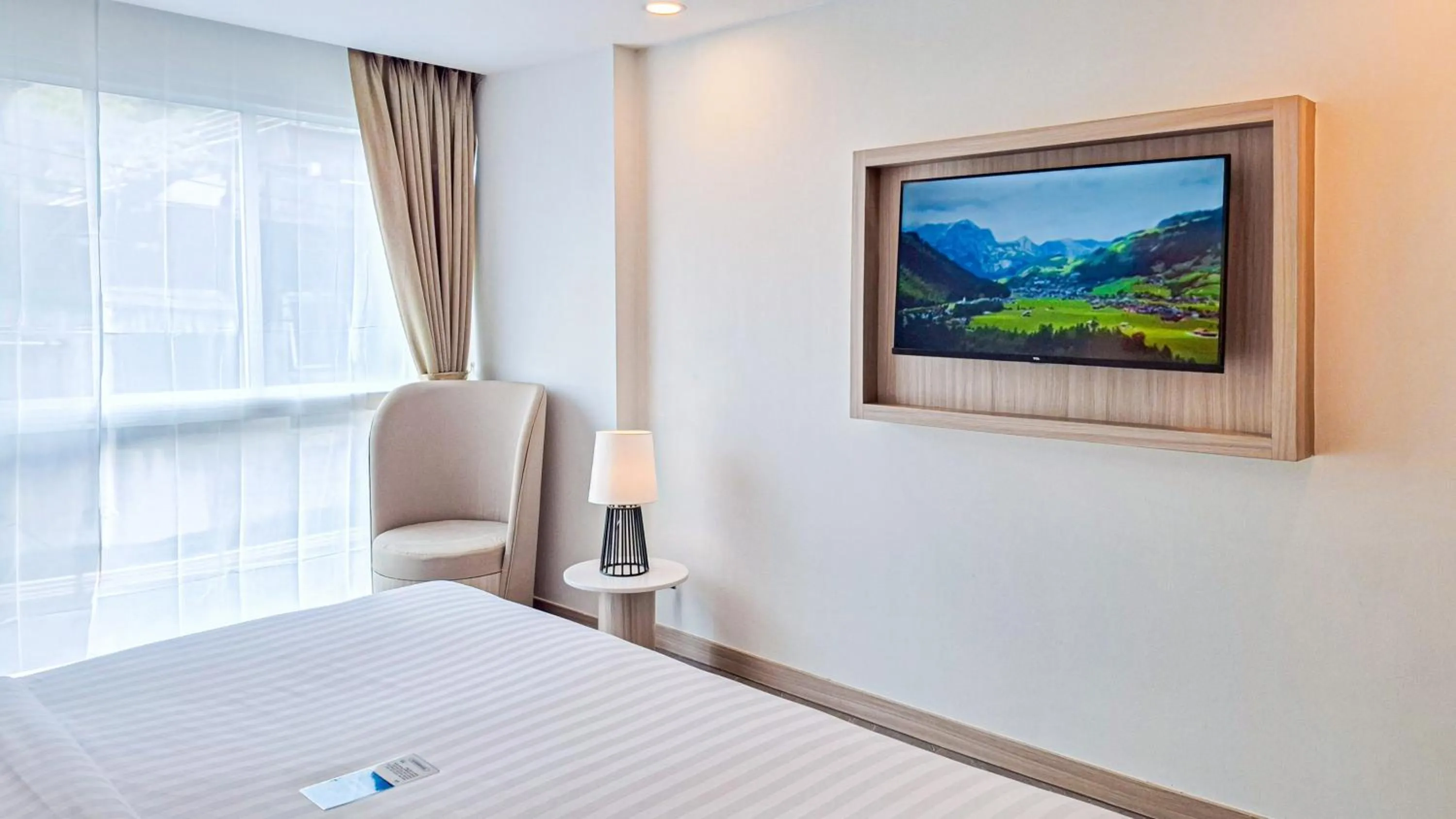 Bed in Clarian Hotel Beach Patong