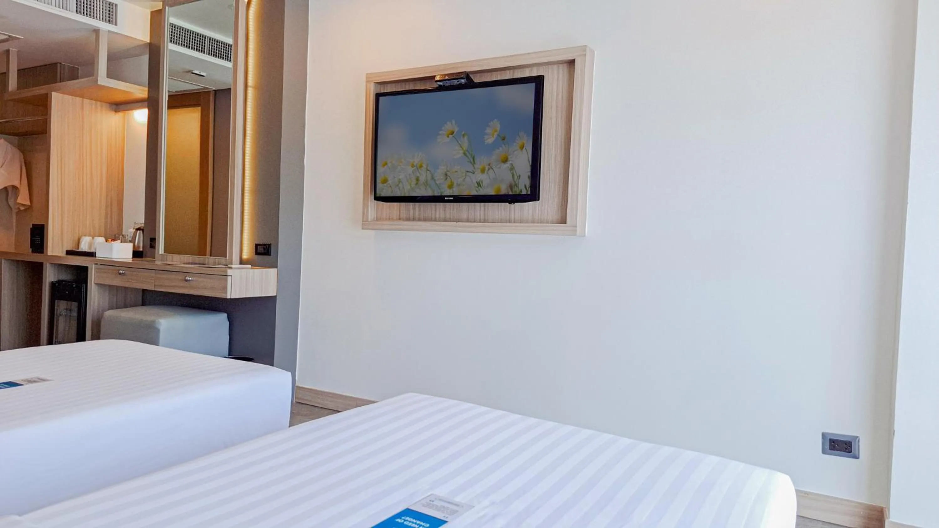 Bed in Clarian Hotel Beach Patong