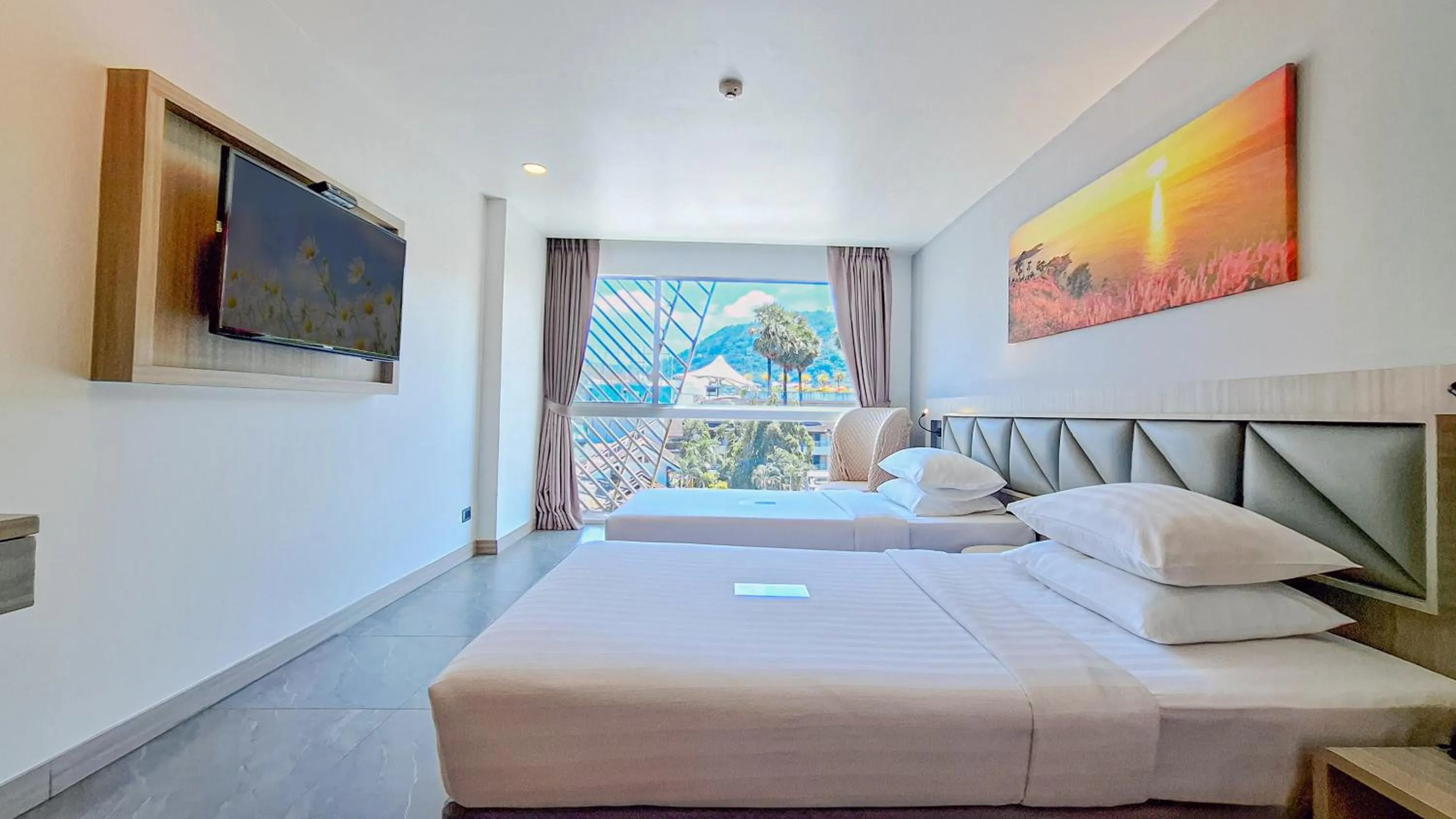 Bed in Clarian Hotel Beach Patong