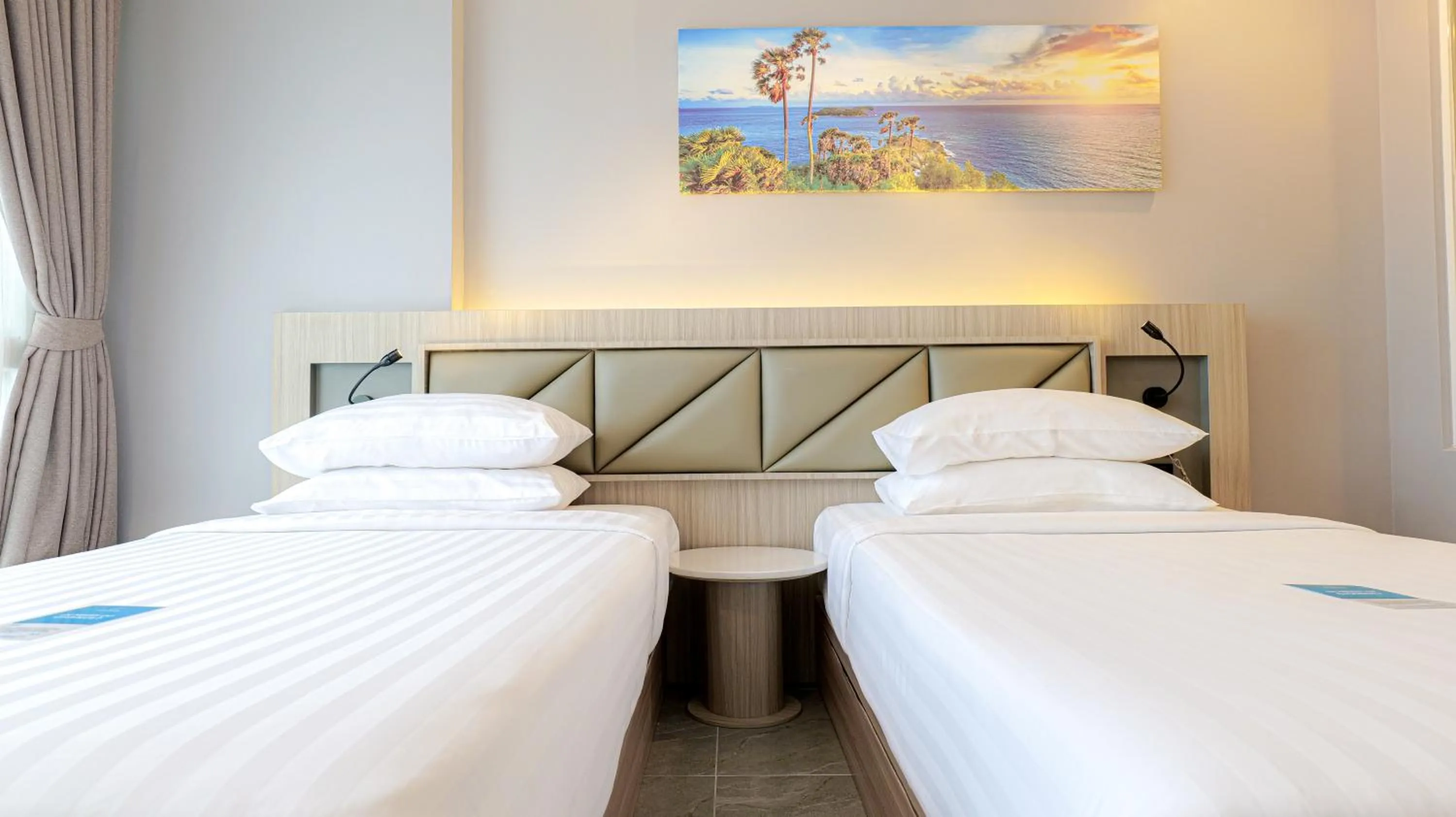 Bed in Clarian Hotel Beach Patong