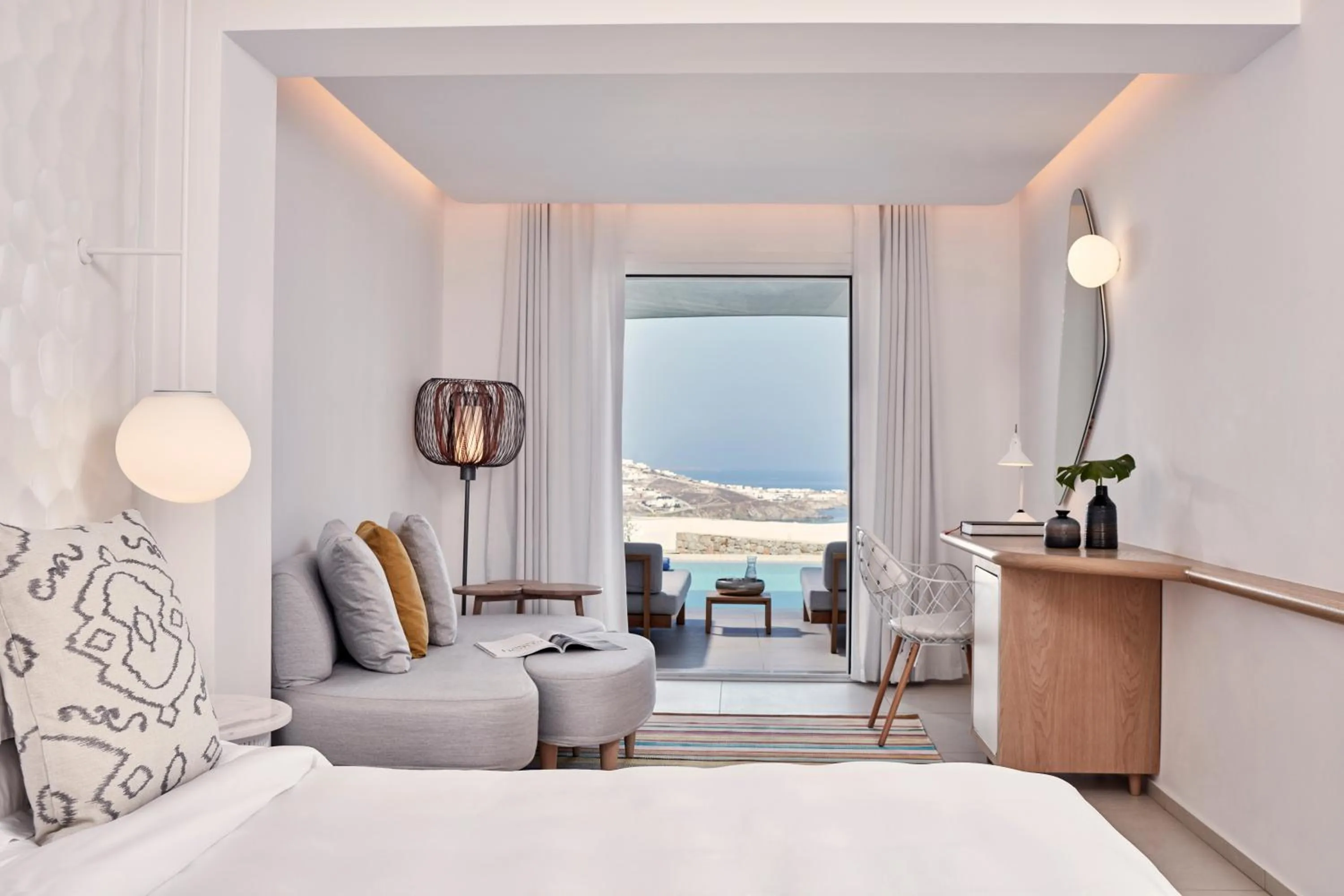 Seating area, Bed in Myconian Kyma, a Member of Design Hotels