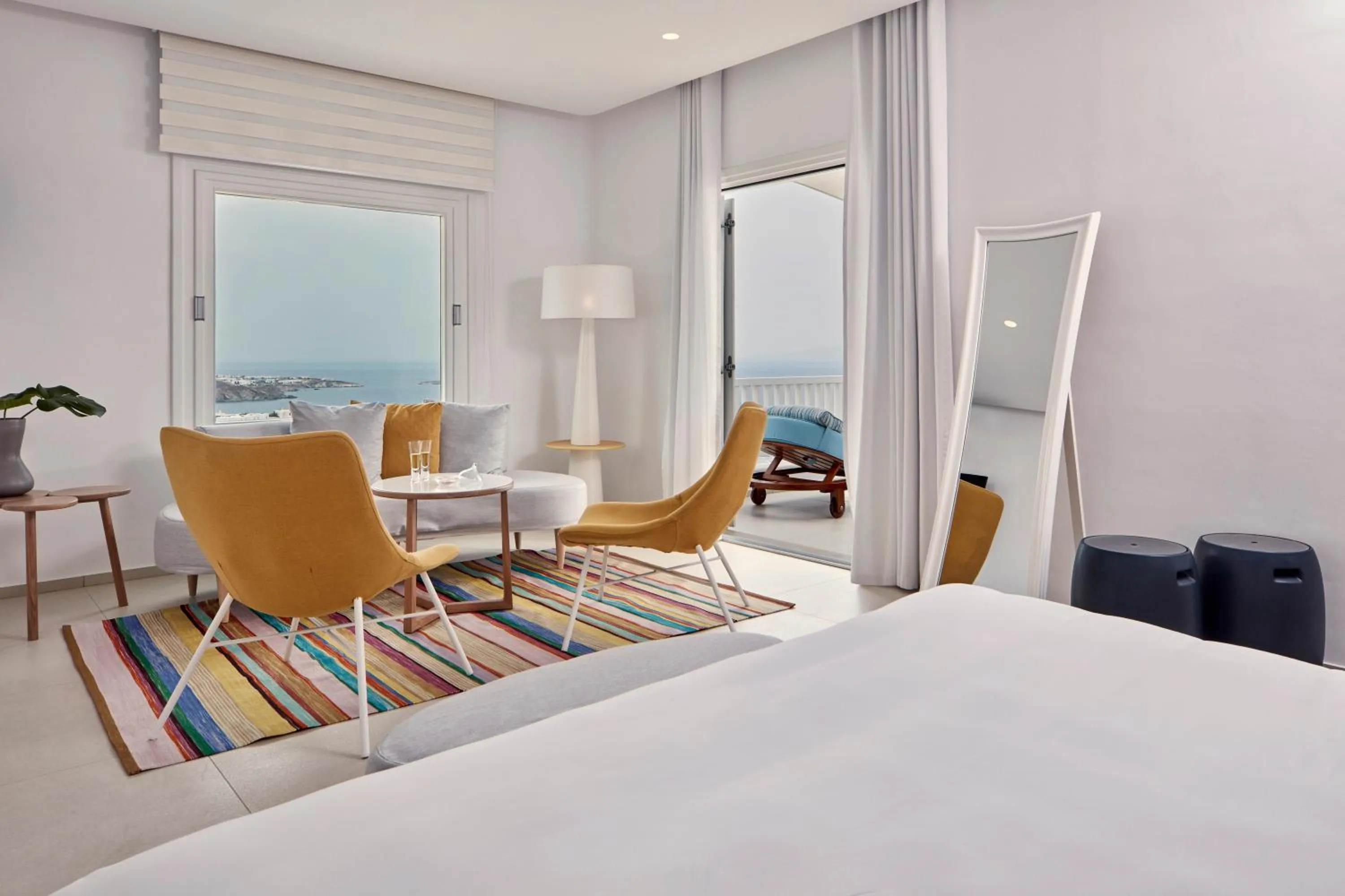 Seating area, Bed in Myconian Kyma, a Member of Design Hotels