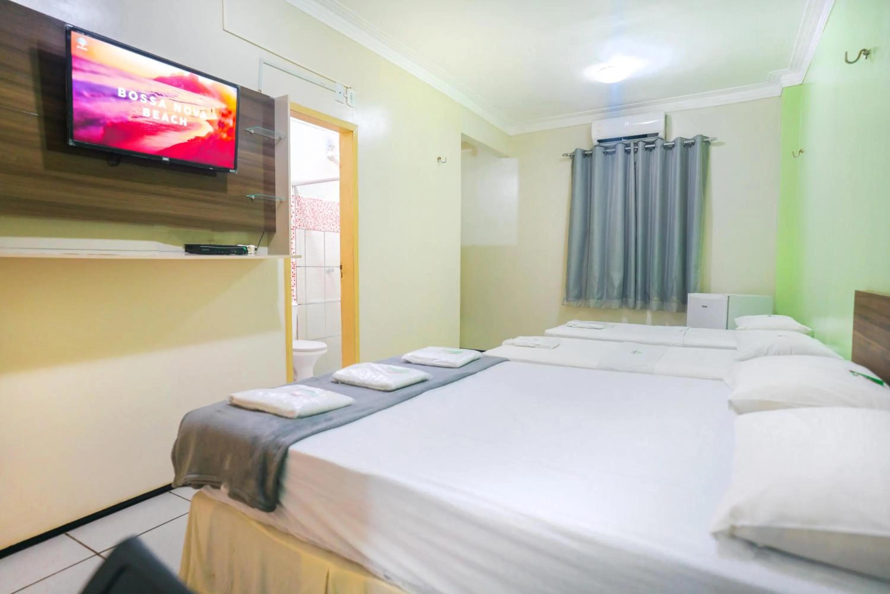 Communal lounge/ TV room, Bed in Hotel Pinheiro