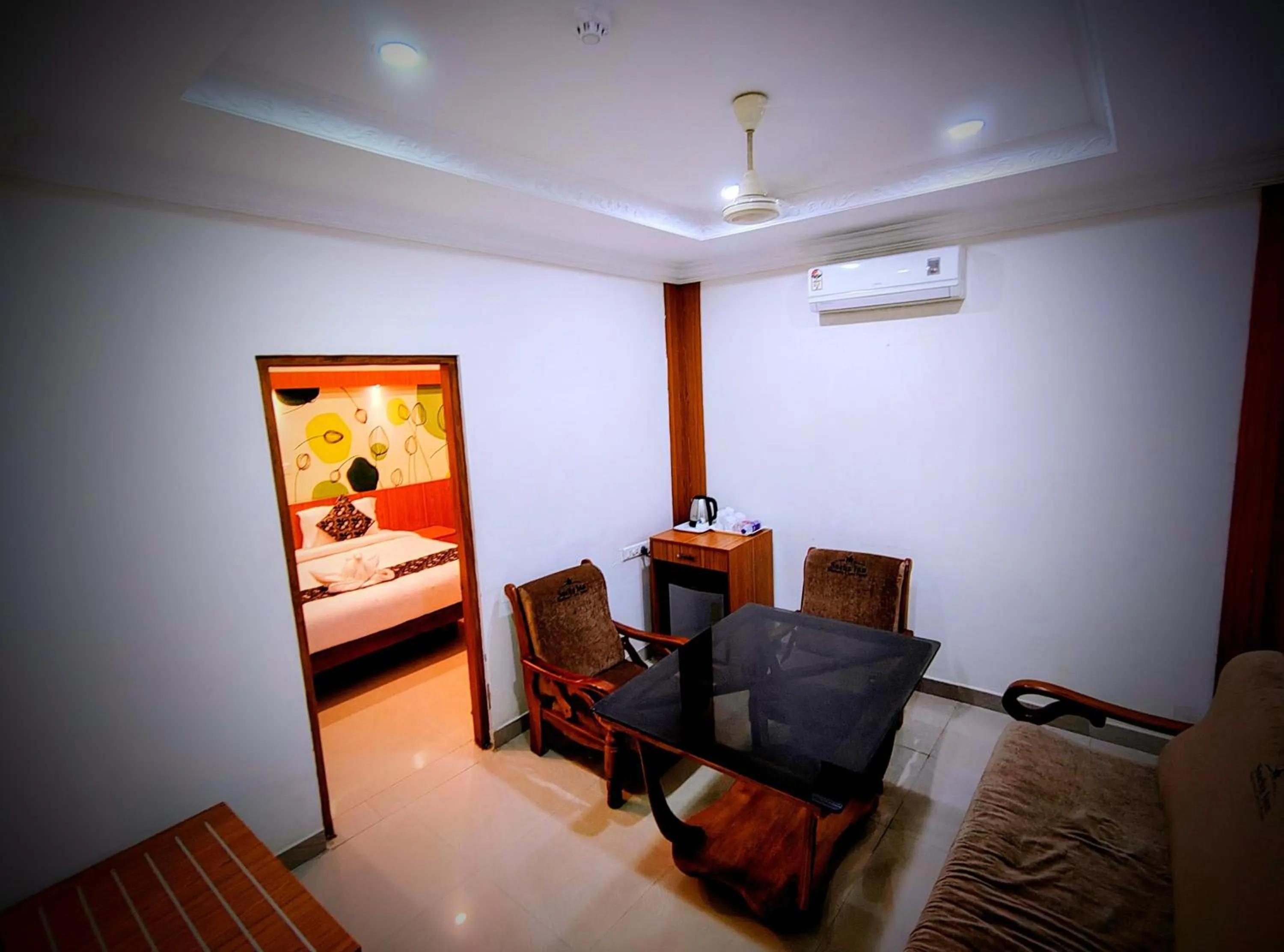 Seating area, Bed in Sneha Inn