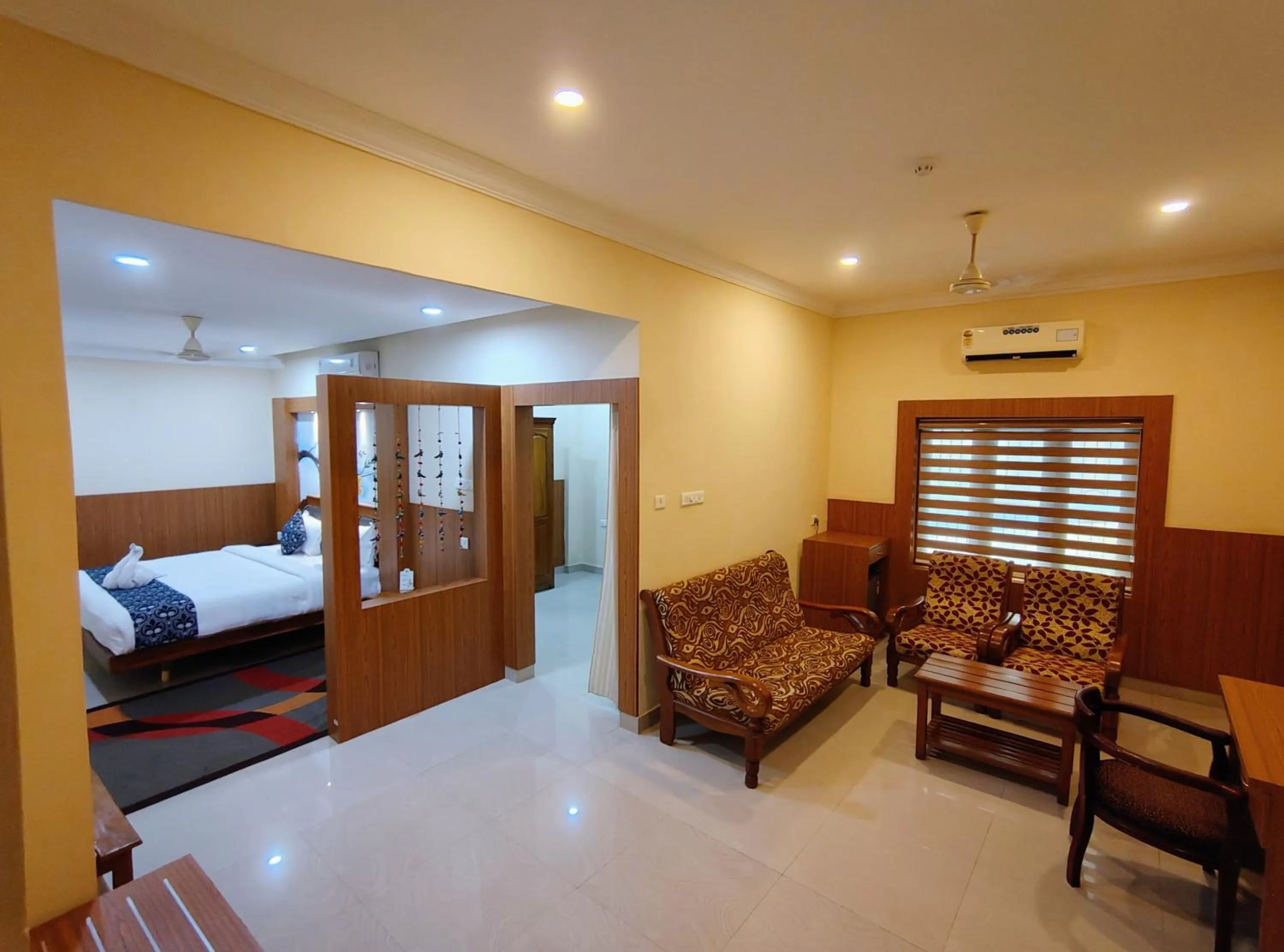 Living room, Bed in Sneha Inn