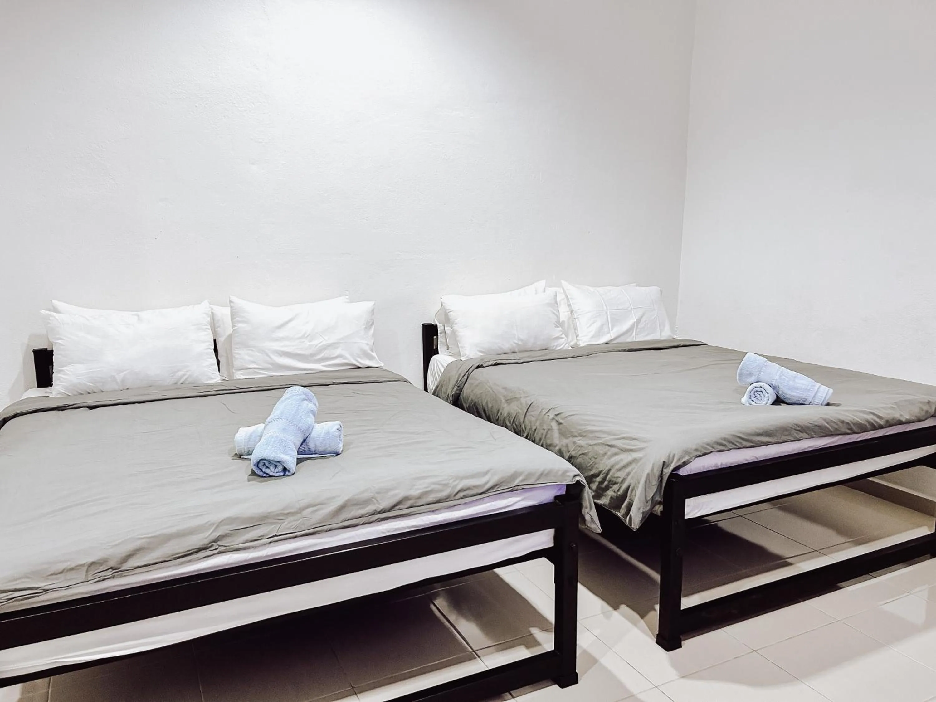 Bed in Belukar Lodges Private Homestay