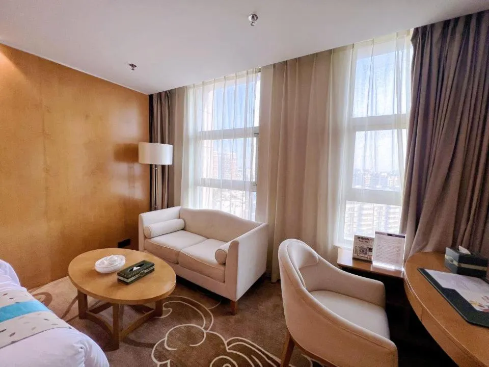 Bed in Menshine Gloria Plaza Hotel