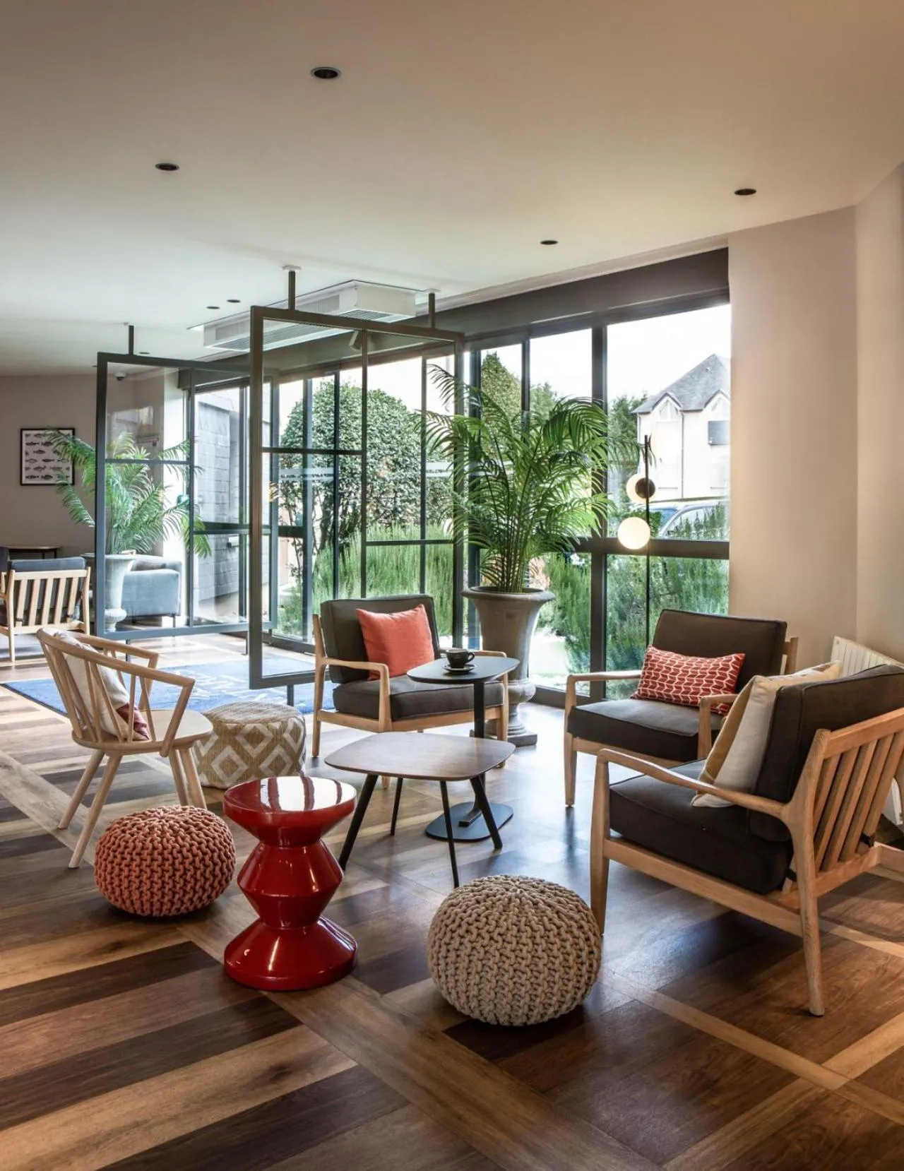 Communal lounge/ TV room in Hôtel Antares & Spa