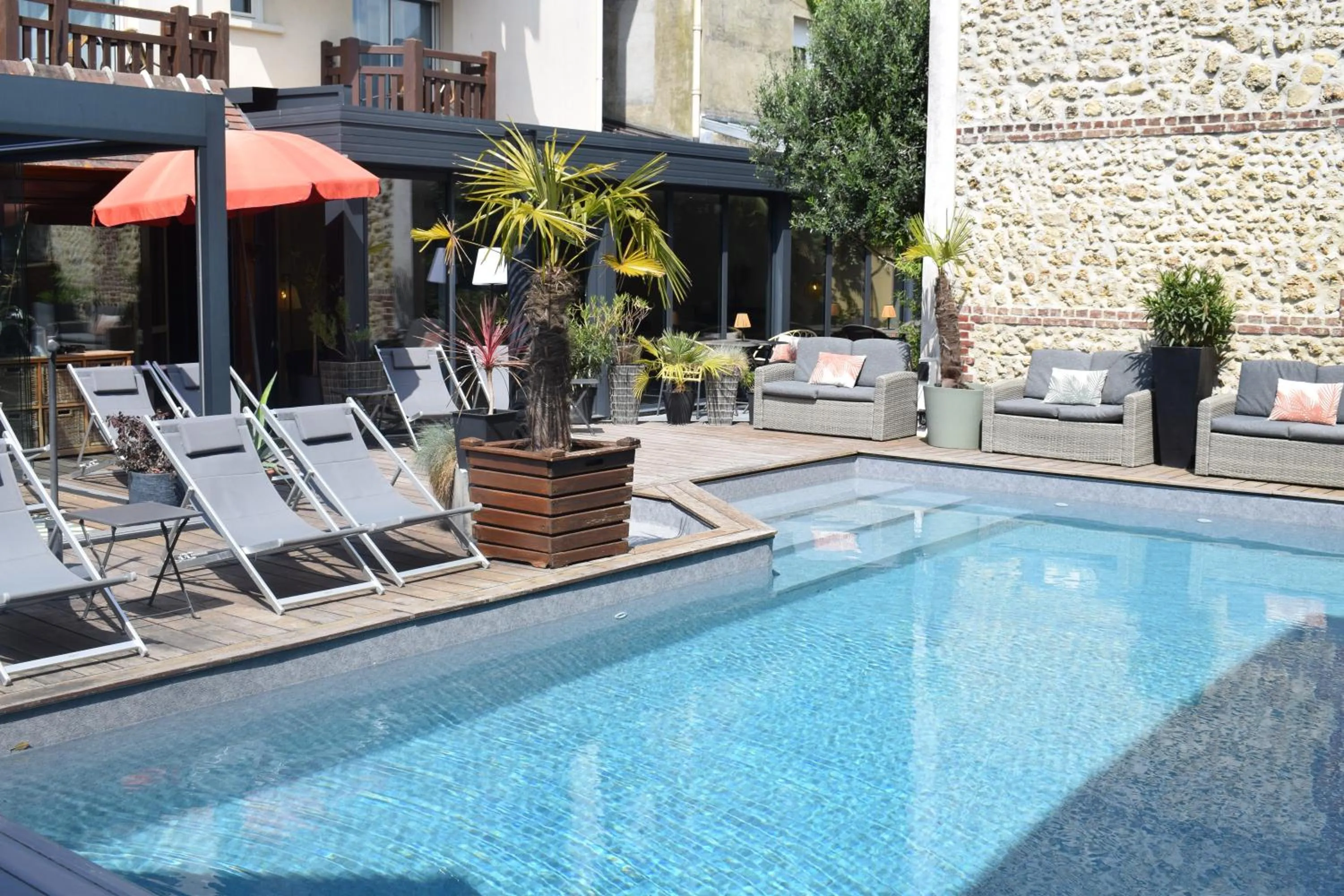 Swimming pool in Le Trophée Boutique Hôtel Spa- La Loggia Appart'hôtel