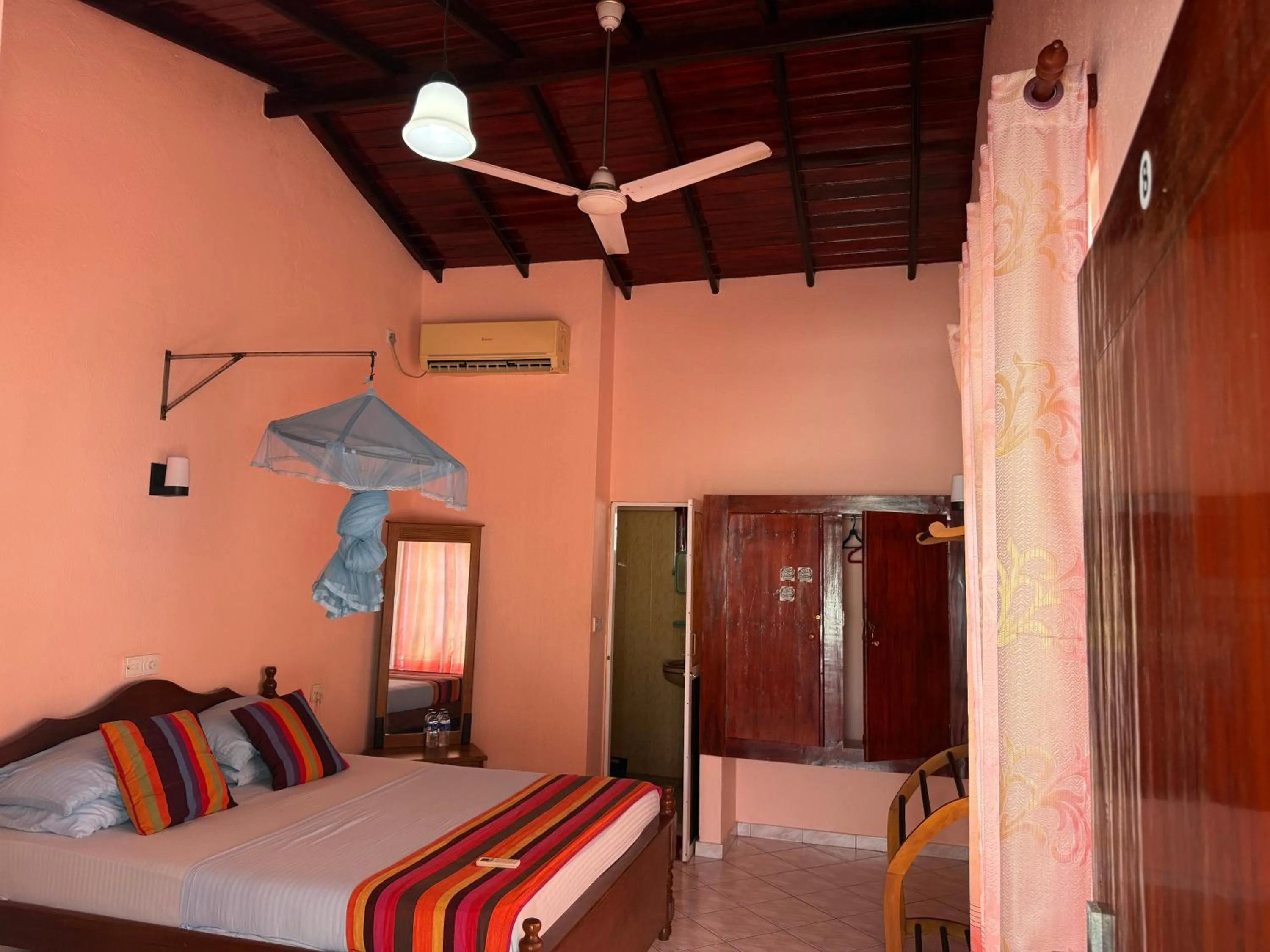 Bed in Samaru Beach House