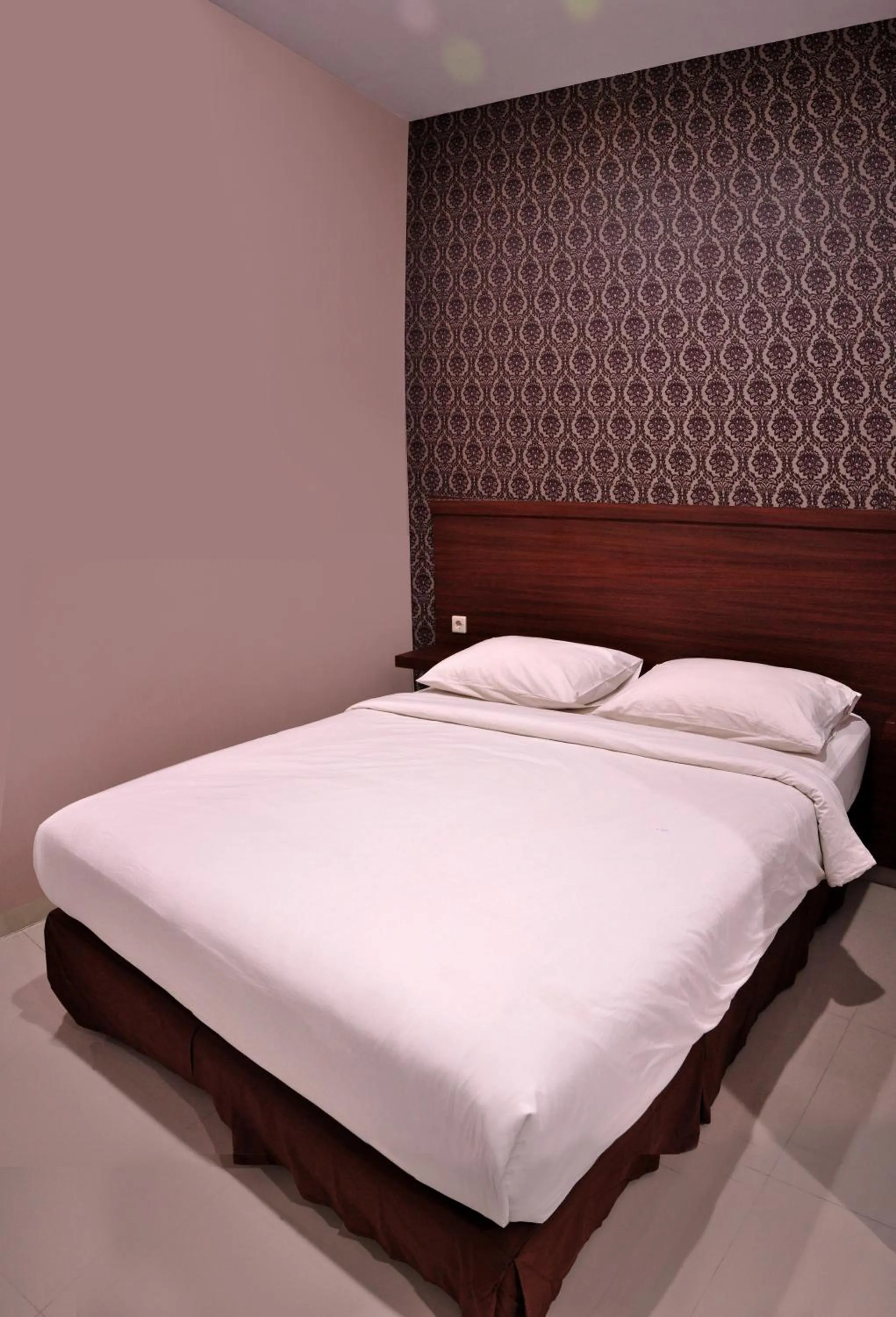 Bed in Grand Kebonsari Guesthouse