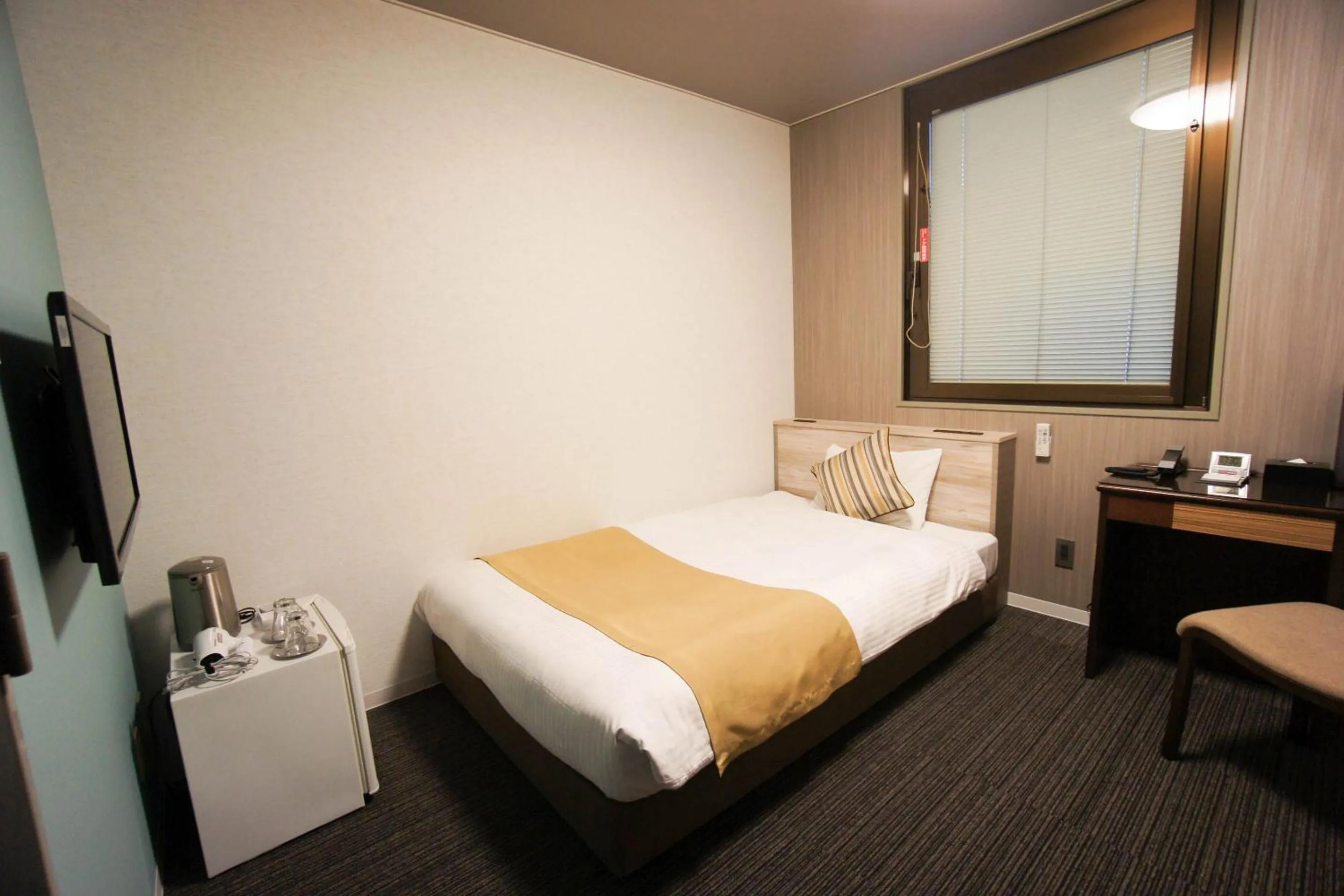 Bed in Hotel AreaOne Nobeoka
