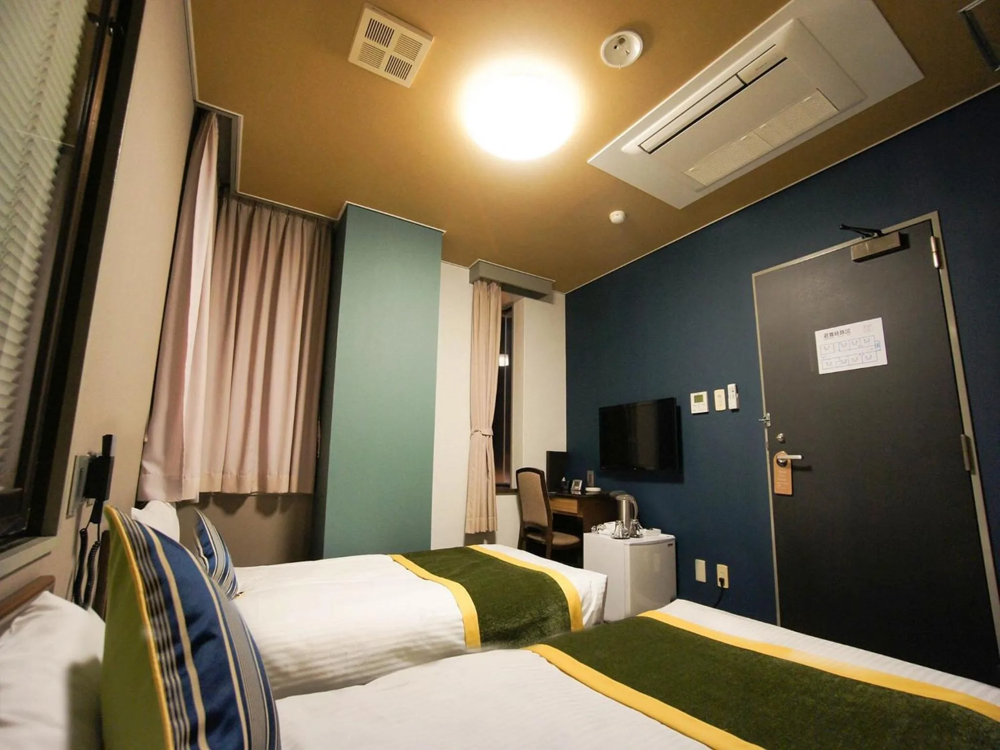 Bed in Hotel AreaOne Nobeoka