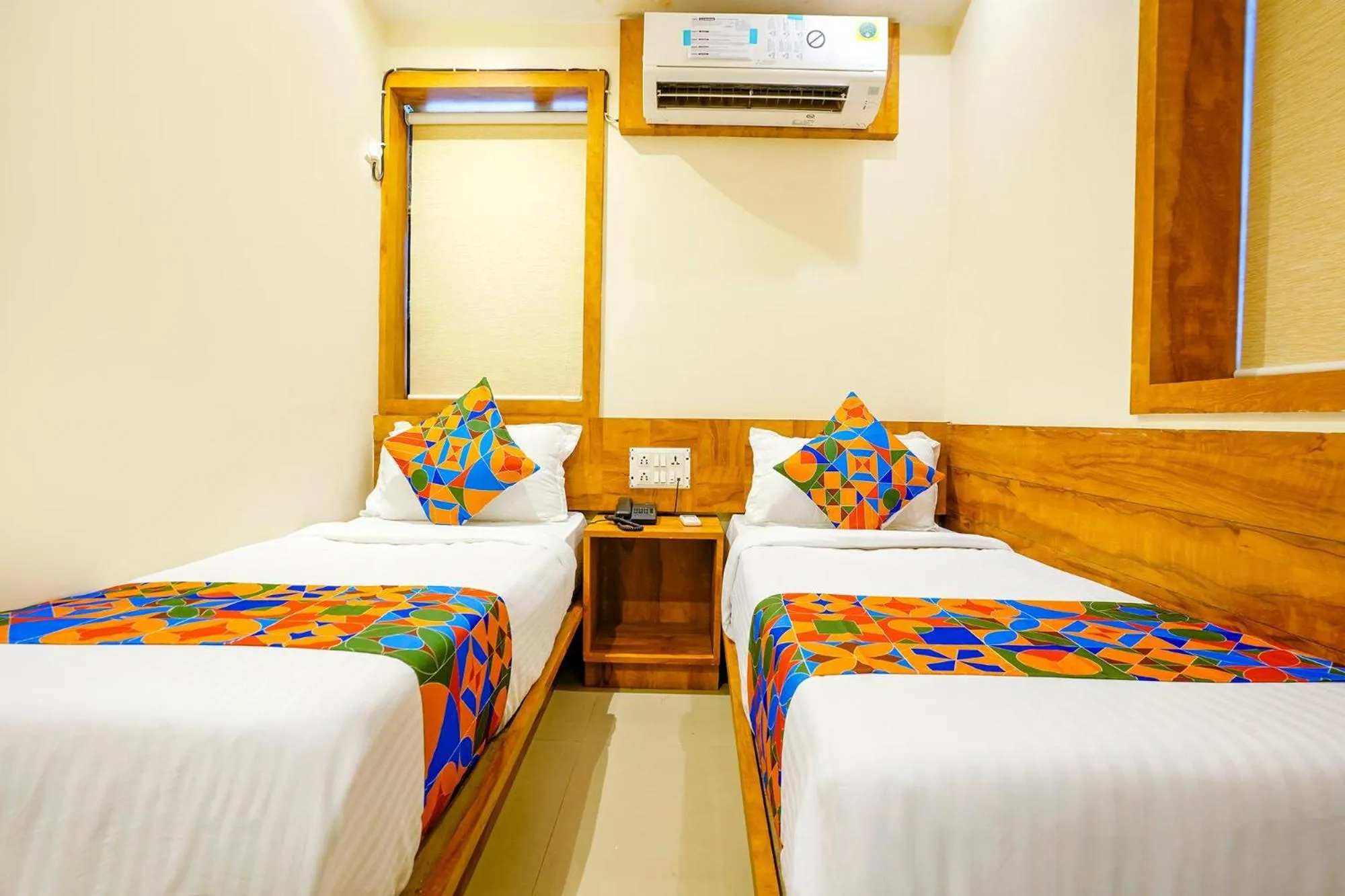 Bed in FabHotel Indore Palace