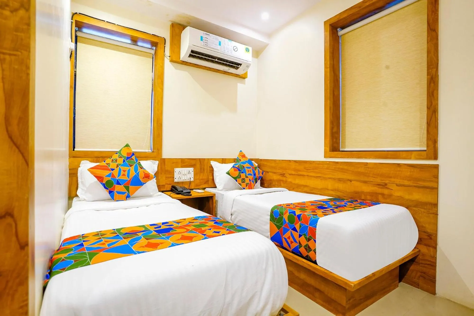 Bed in FabHotel Indore Palace