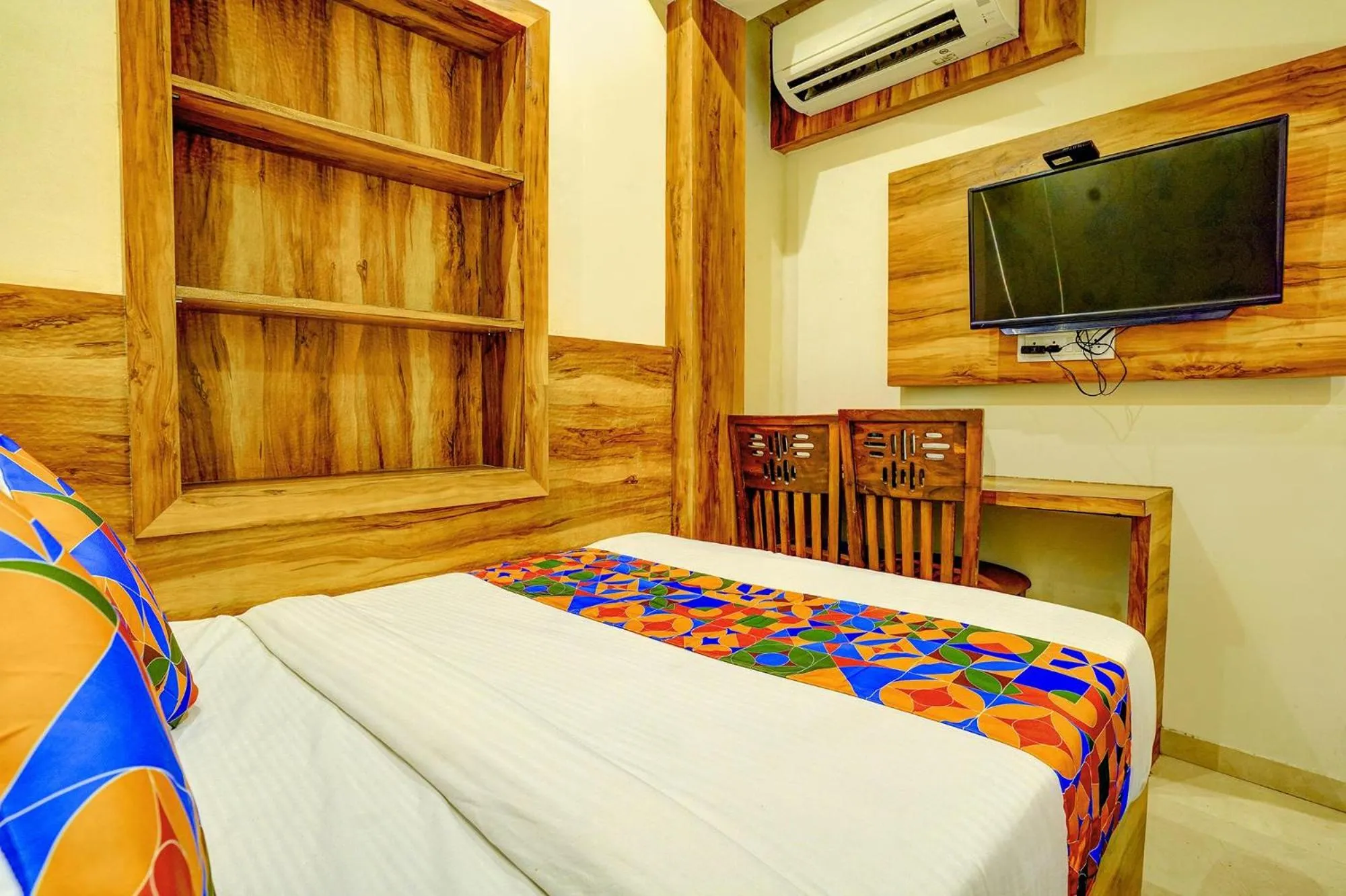 Bed in FabHotel Indore Palace